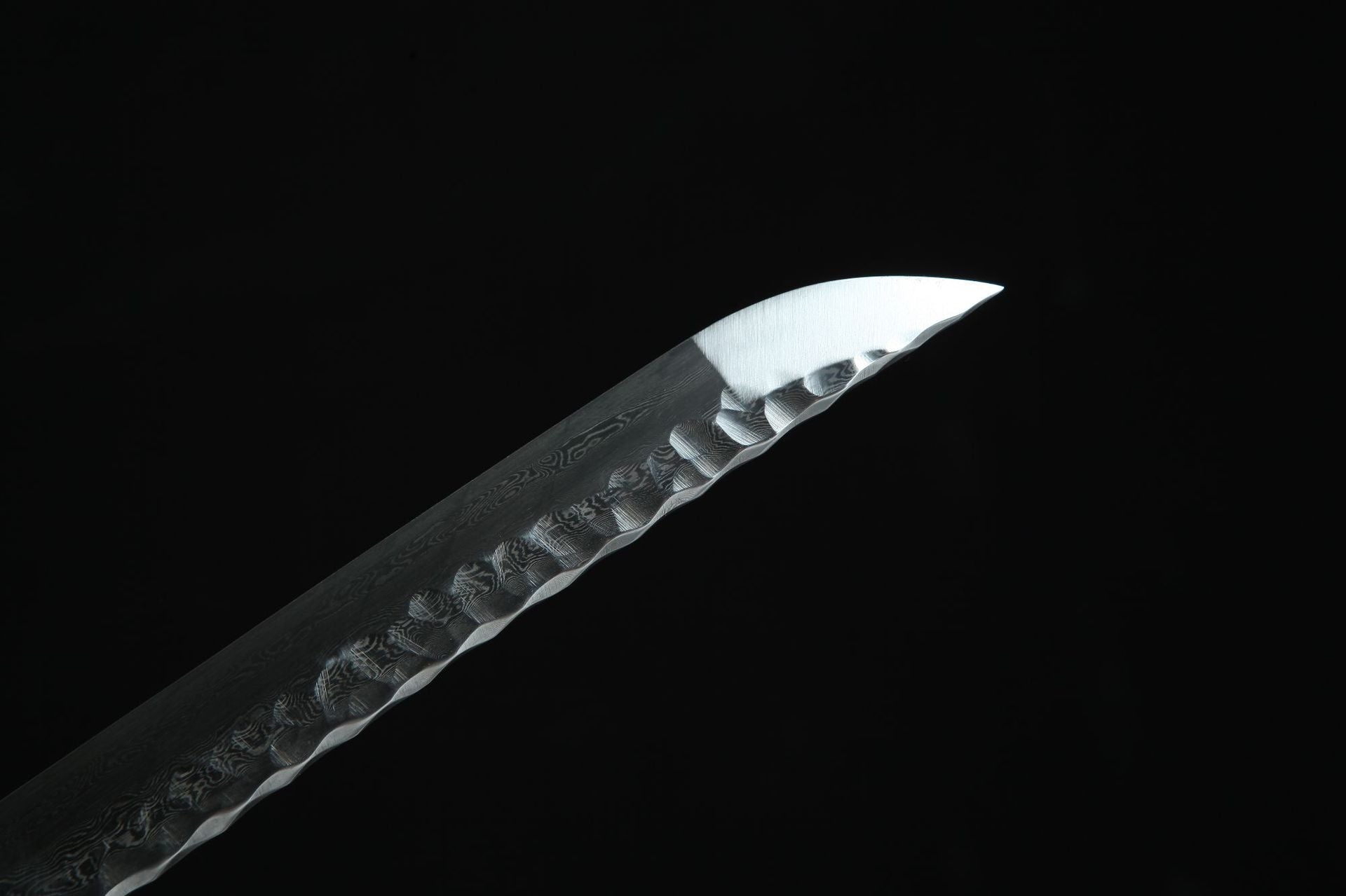 Close-up of the Damascus steel blade edge.
