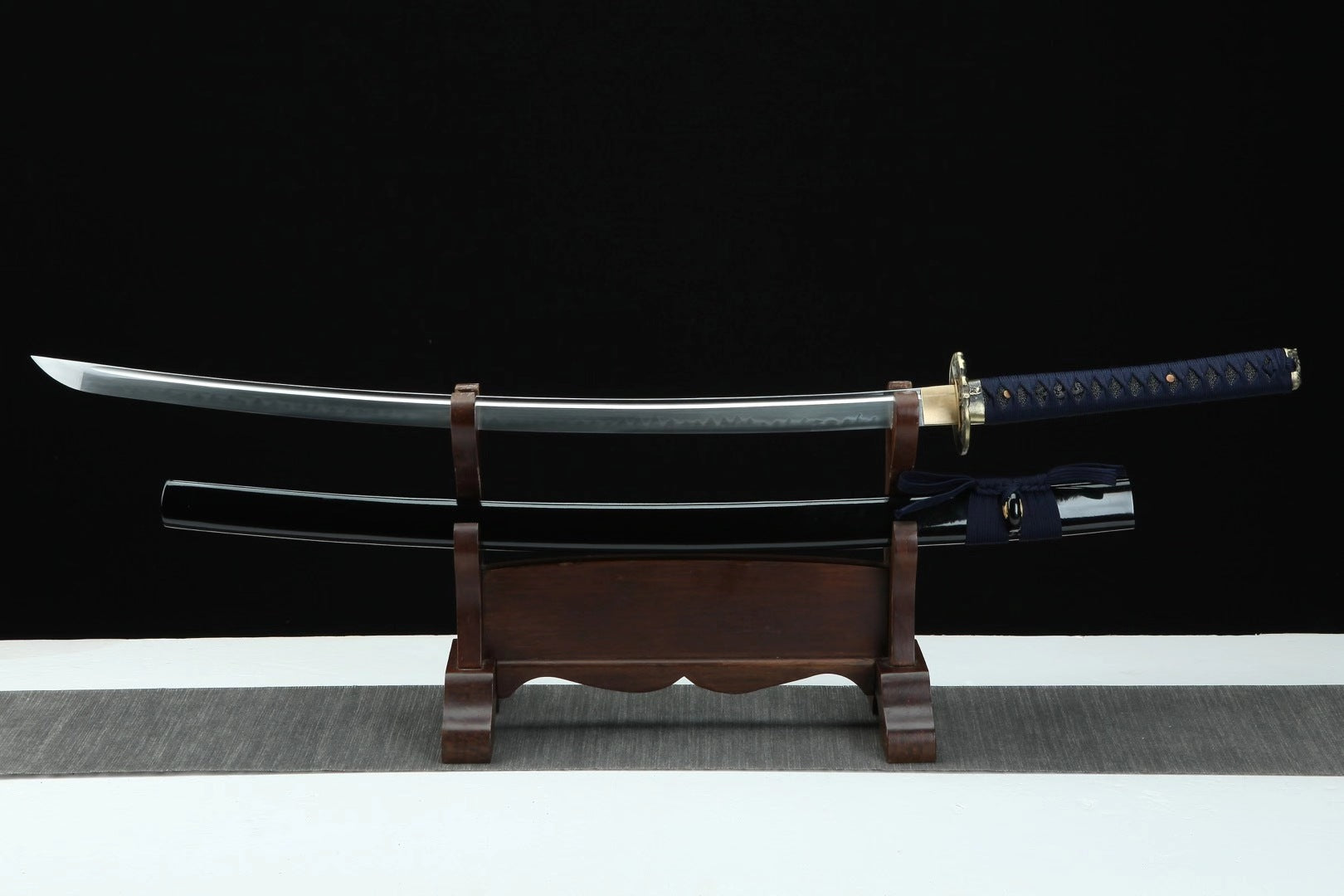 The "Devil" clay-tempered true katana, available for purchase in the US, featuring a beautifully crafted blade.