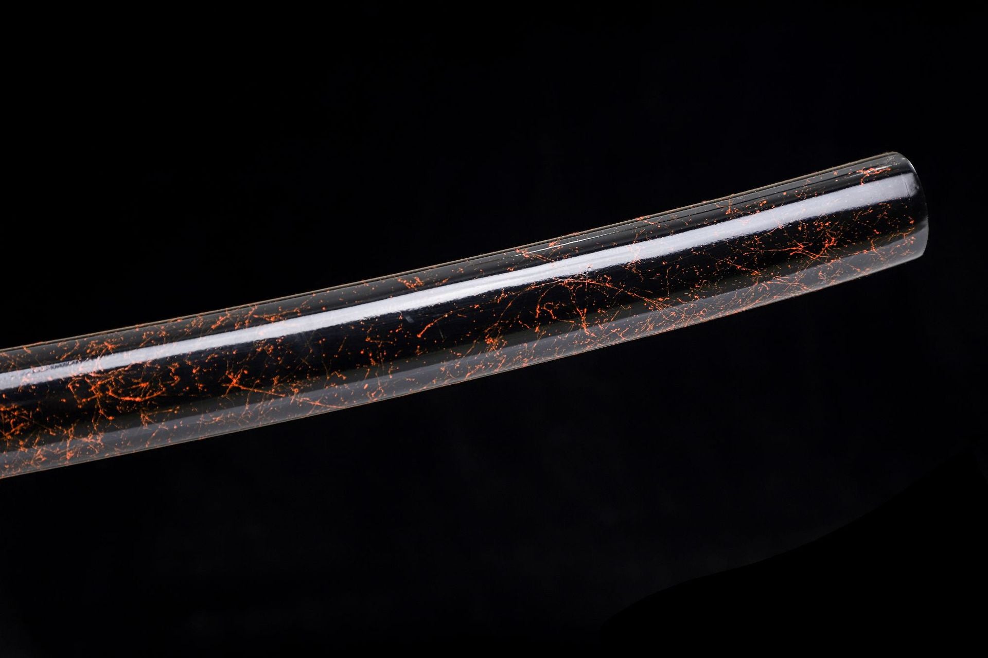 Close-up of the glossy brown lacquered saya, showcasing its smooth finish and elegant sheen.