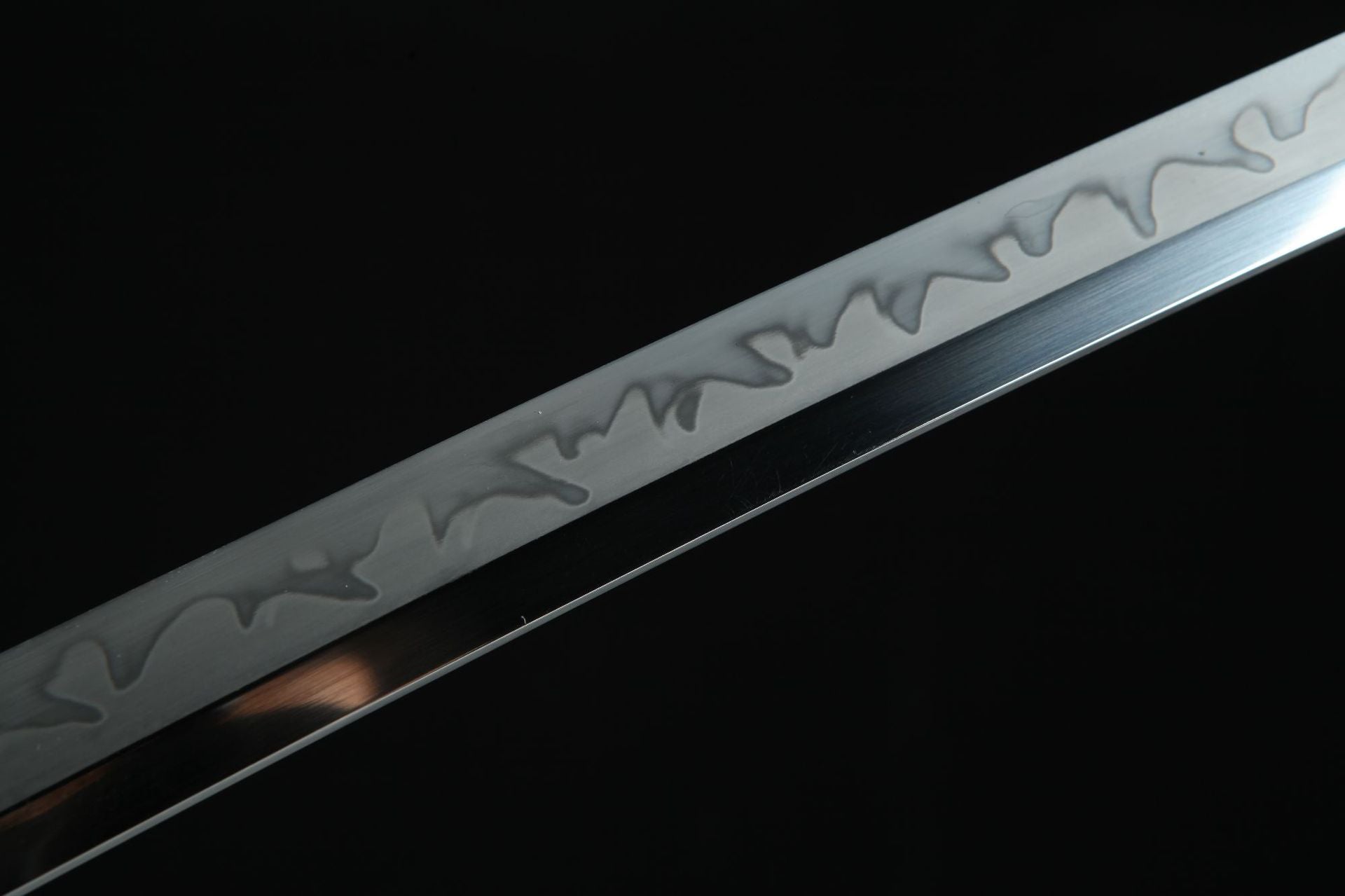 Hand-forged Magatama katana blade made of high carbon steel with detailed hamon pattern.