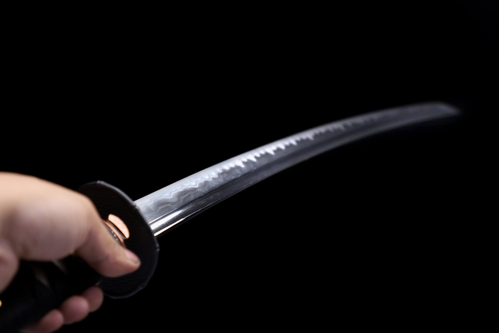 Hand gripping the Guardian katana.