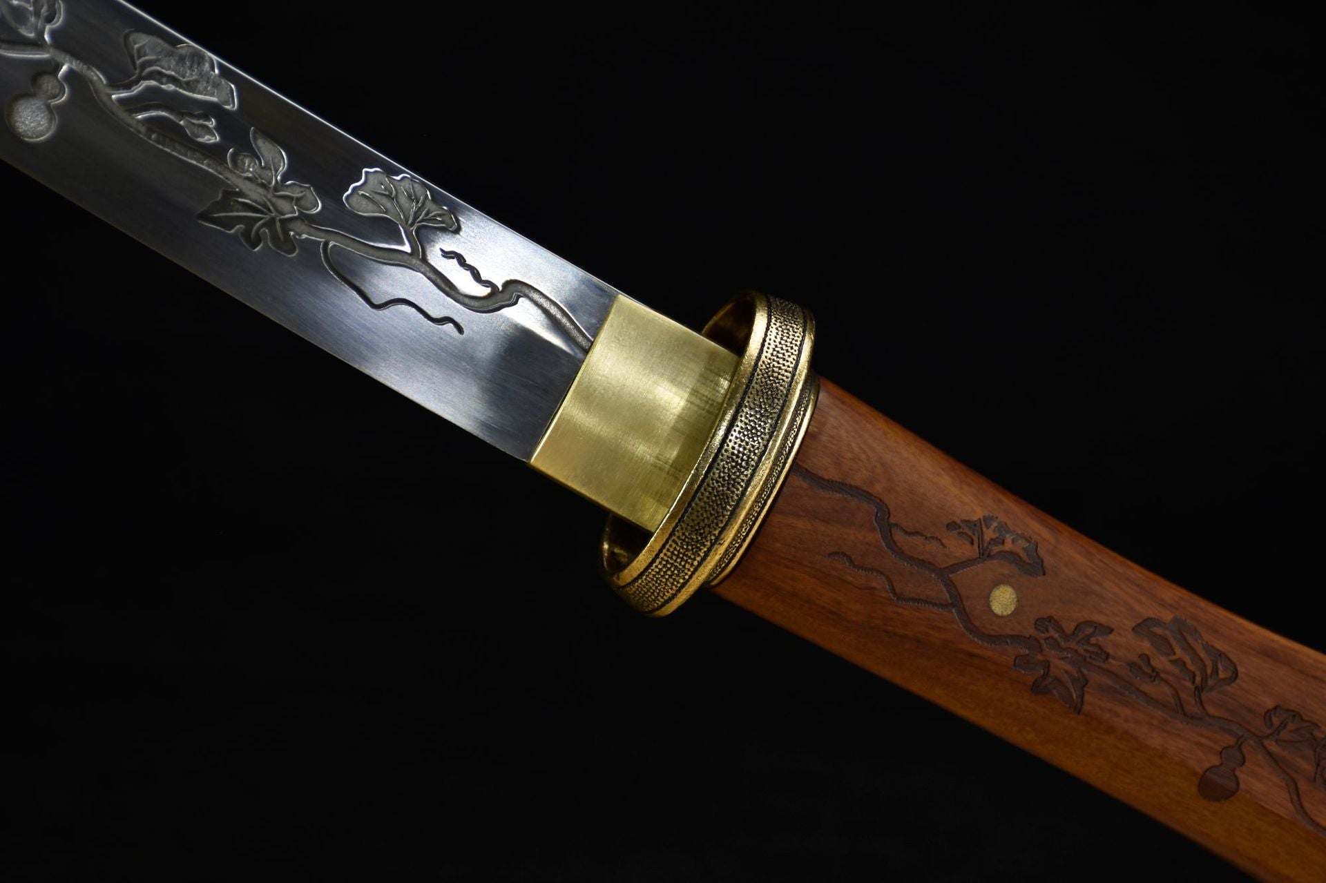 A detailed view of the katana blade and handle featuring a continuous gourd carving, reflecting the essence of Eastern cultural design.