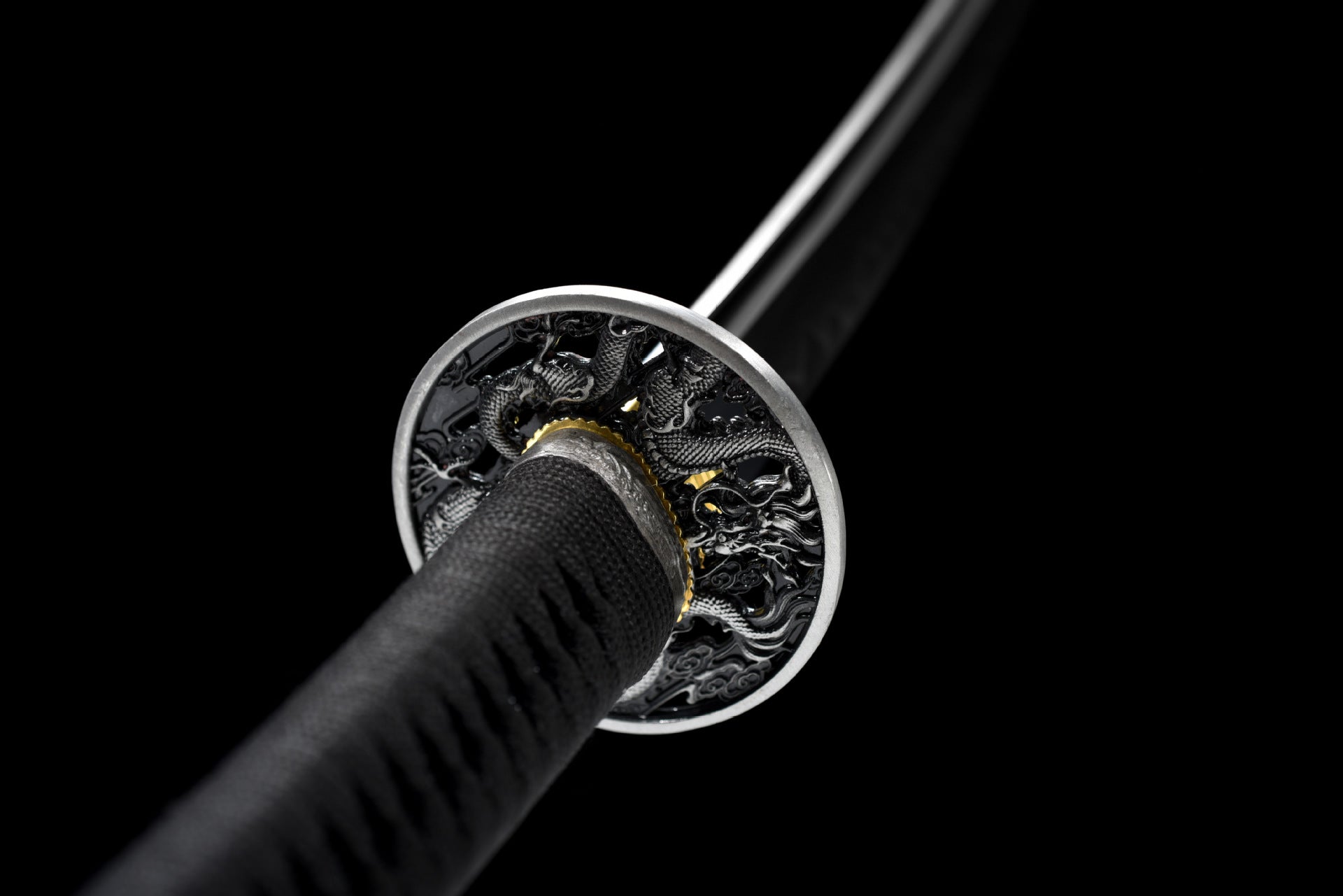 Close-up of the katana tsuba featuring intricate loong details, highlighting the mythical design and craftsmanship.