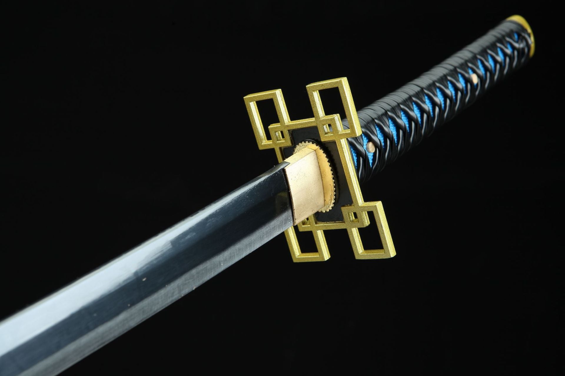 The tsuba of Muichiro's sword, featuring a central rectangular frame with four small rectangles at the corners, in a gold color.