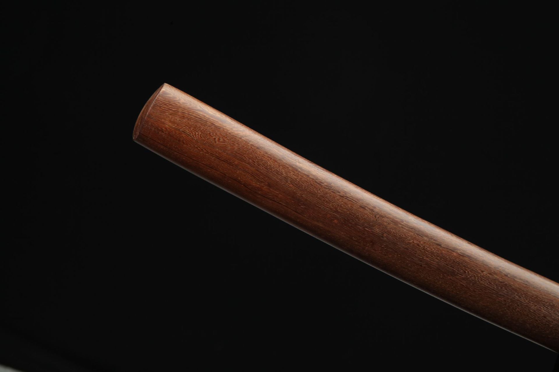 Close-up of the natural wood saya, showcasing the smooth grain and finish