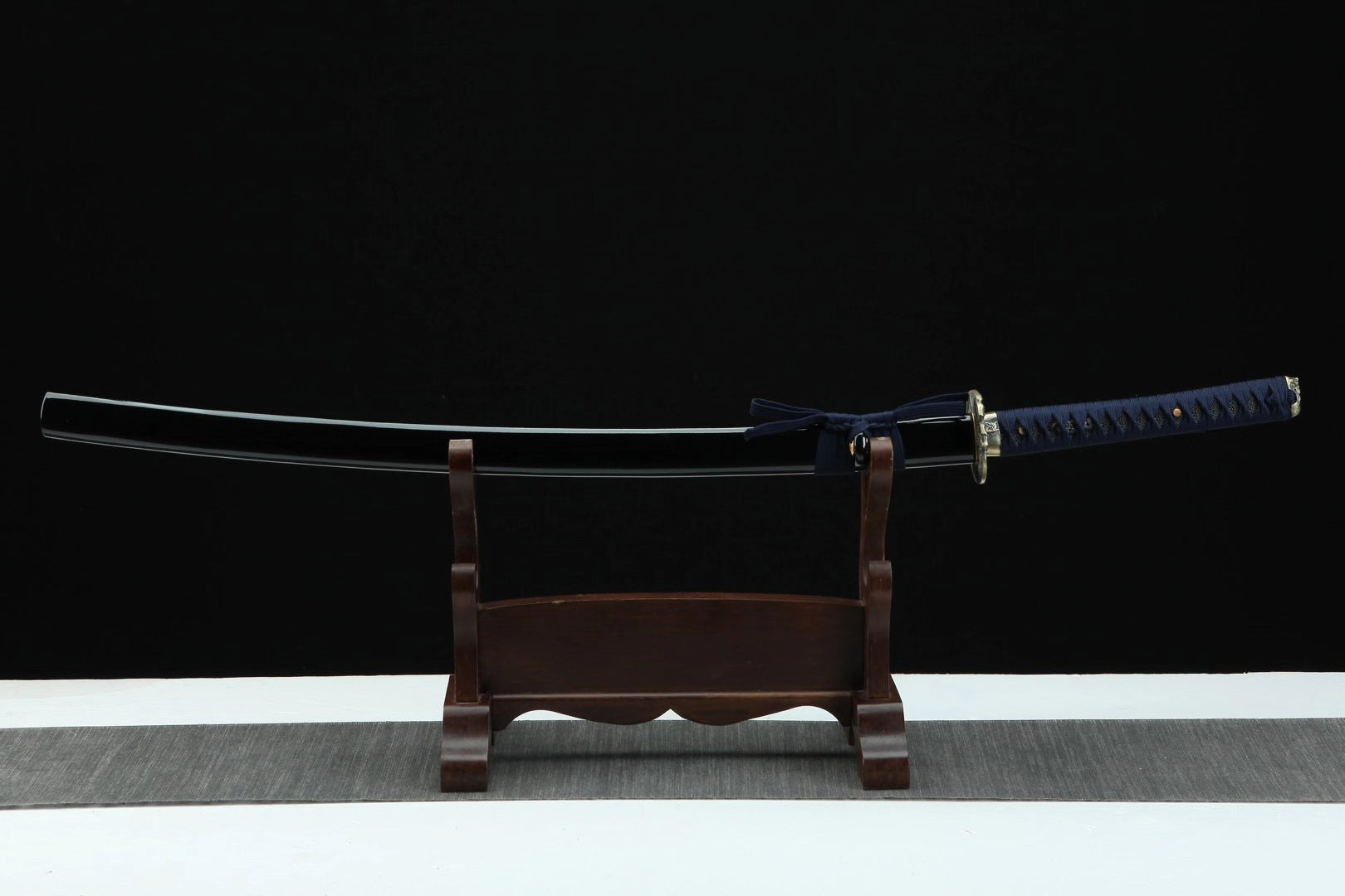 A full view of the navy blue katana sheathed in its saya, showcasing its sleek design, perfect for collectors.