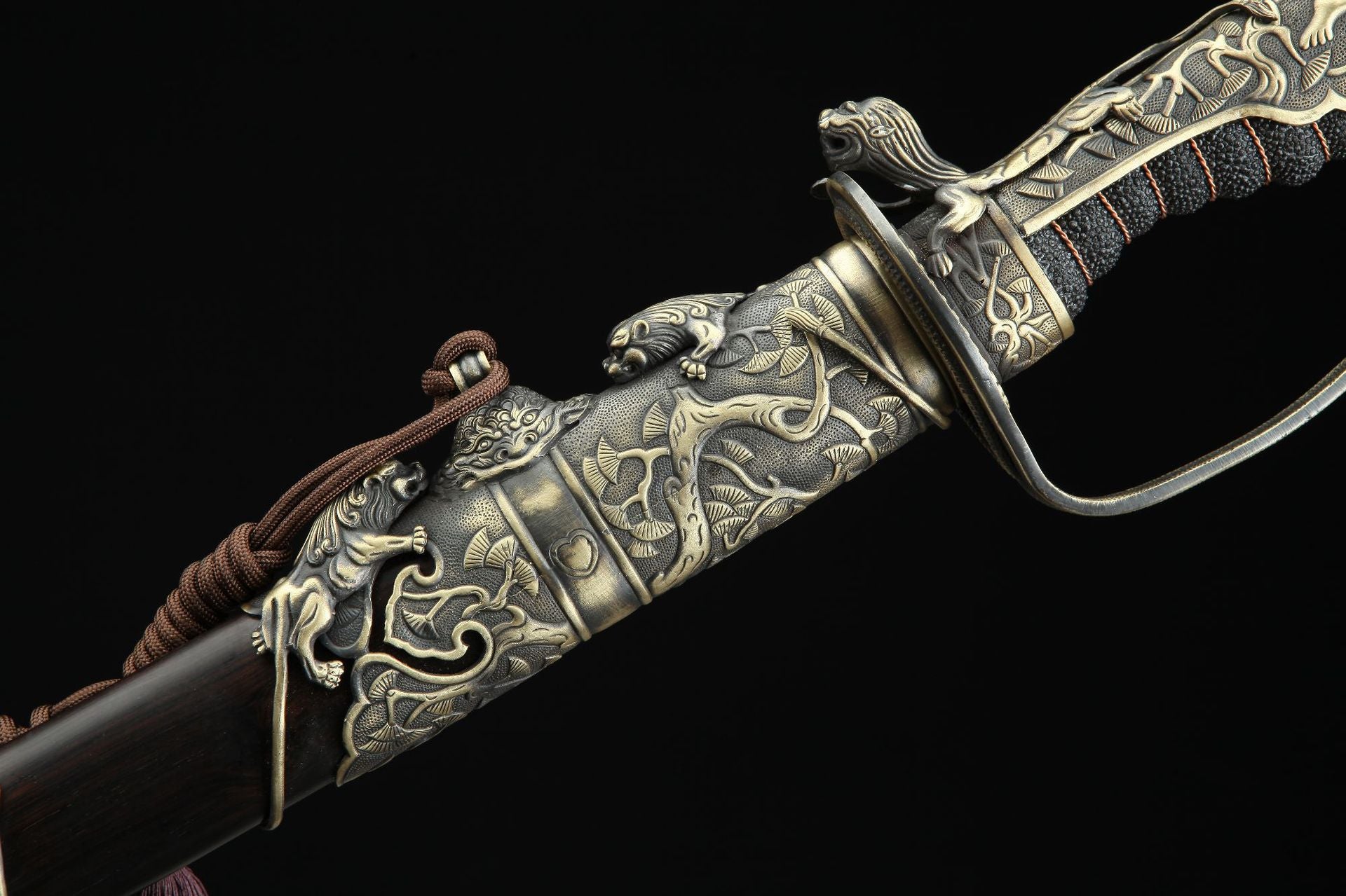 Ornate saya of Nine Lions gunto with lion-themed metal carvings.