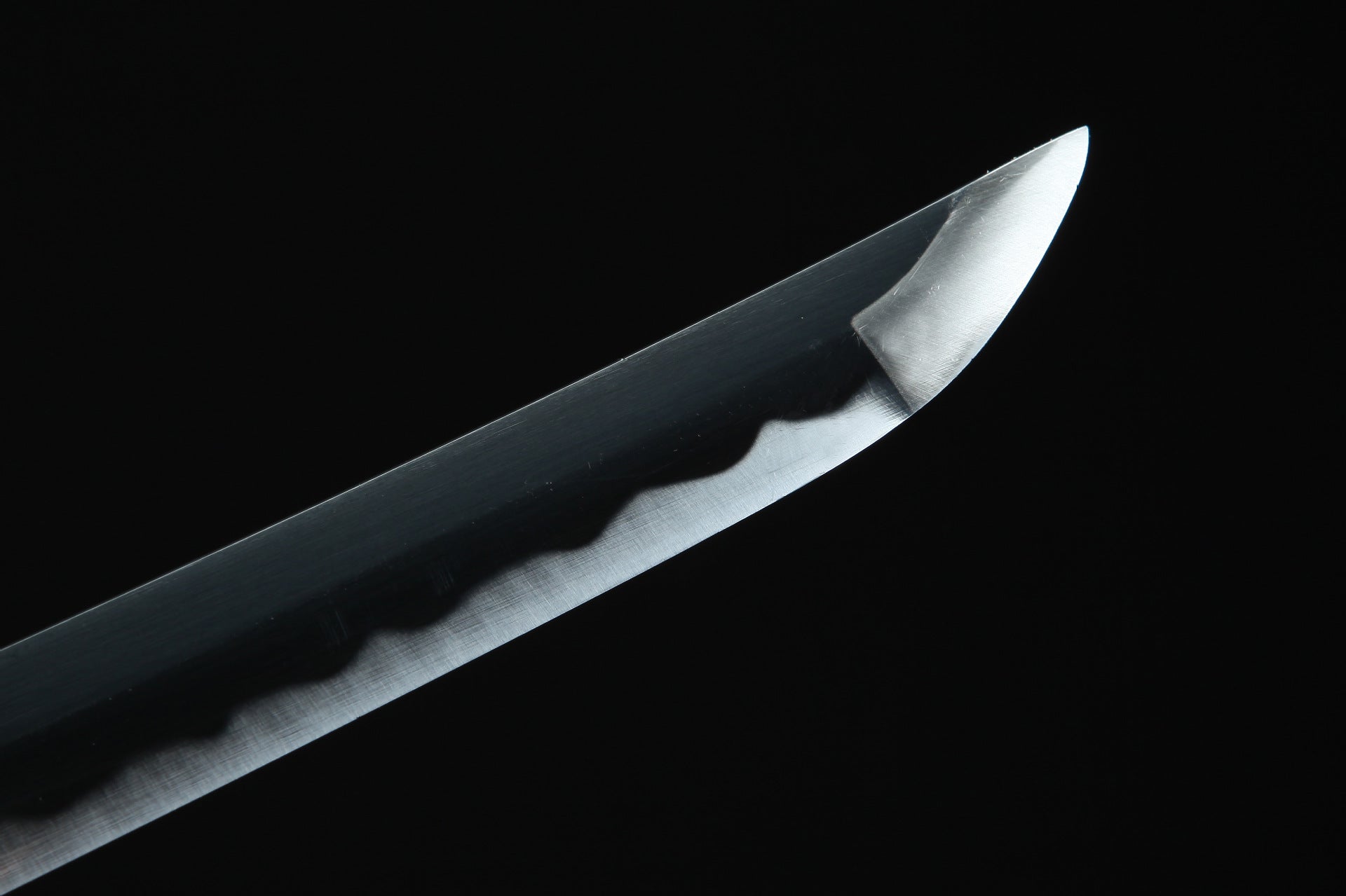 Close-up of the blade tip of Roronoa Zoro's katana from One Piece.