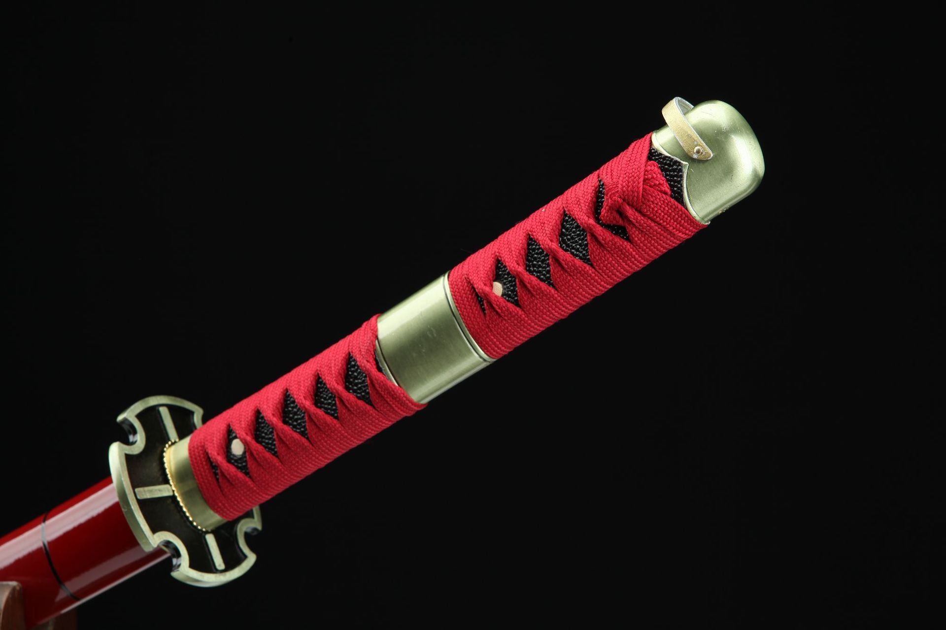 Red handle of Roronoa Zoro's Sandai Kitetsu katana from One Piece.