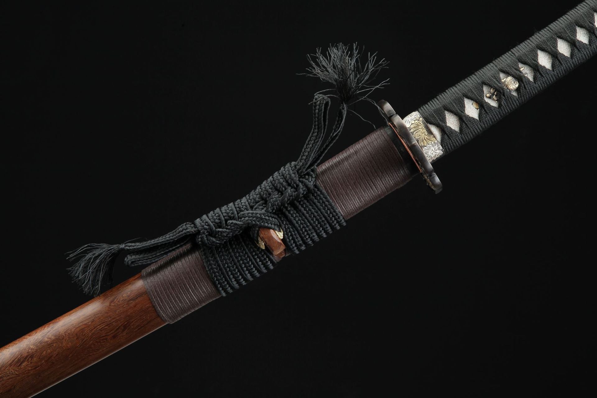 Close-up of the sageo on the saya, showcasing the knotting detail.