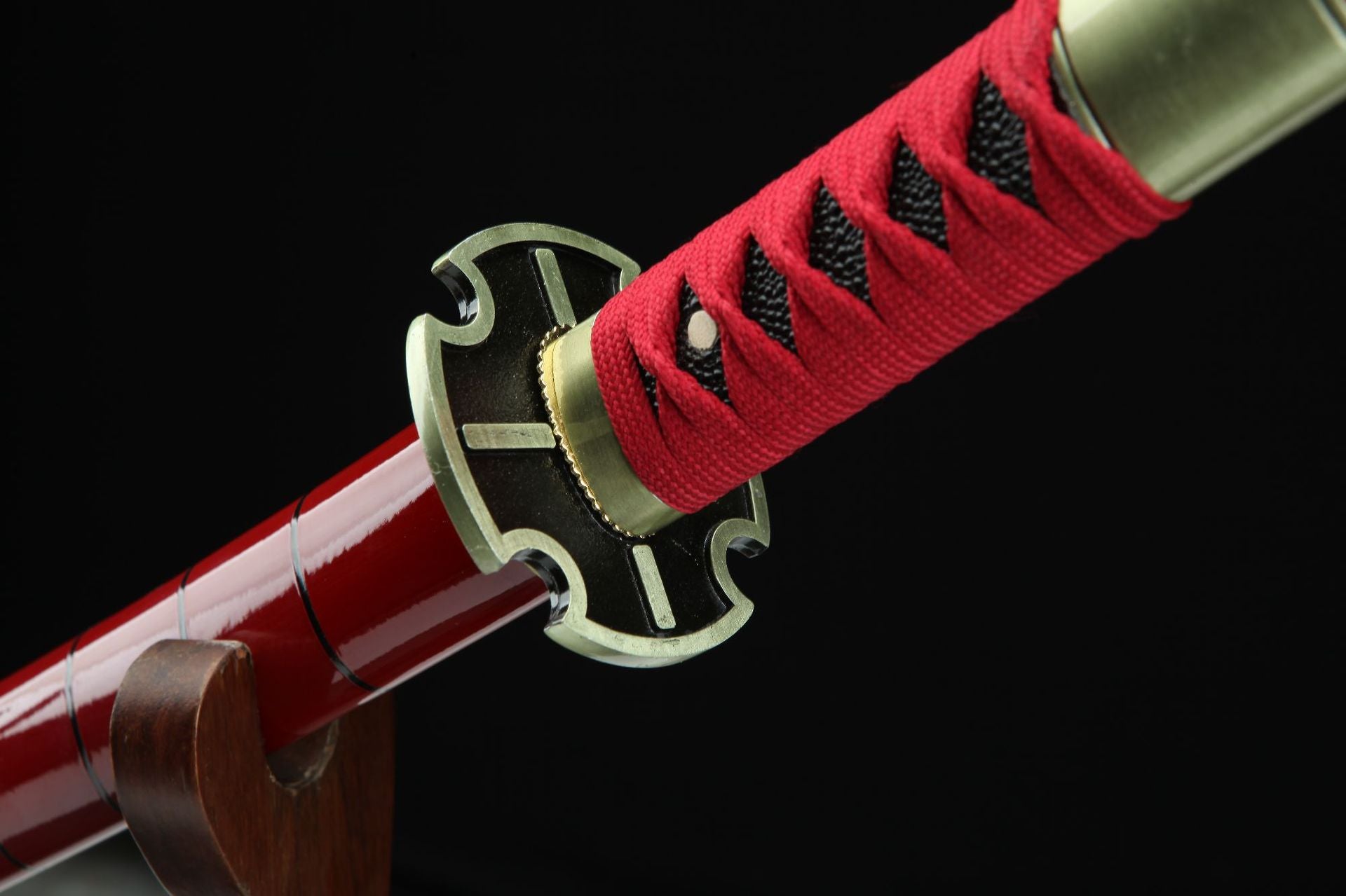 Black and gold guard of Sandai Kitetsu sword.