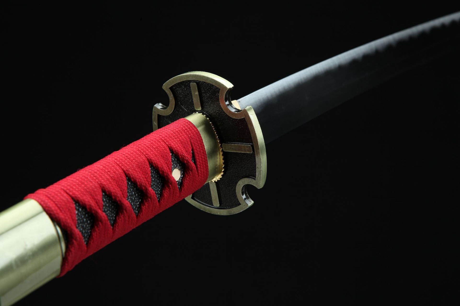 Close-up of the guard of Sandai Kitetsu, Zoro's sword from One Piece, wrapped in red cord.