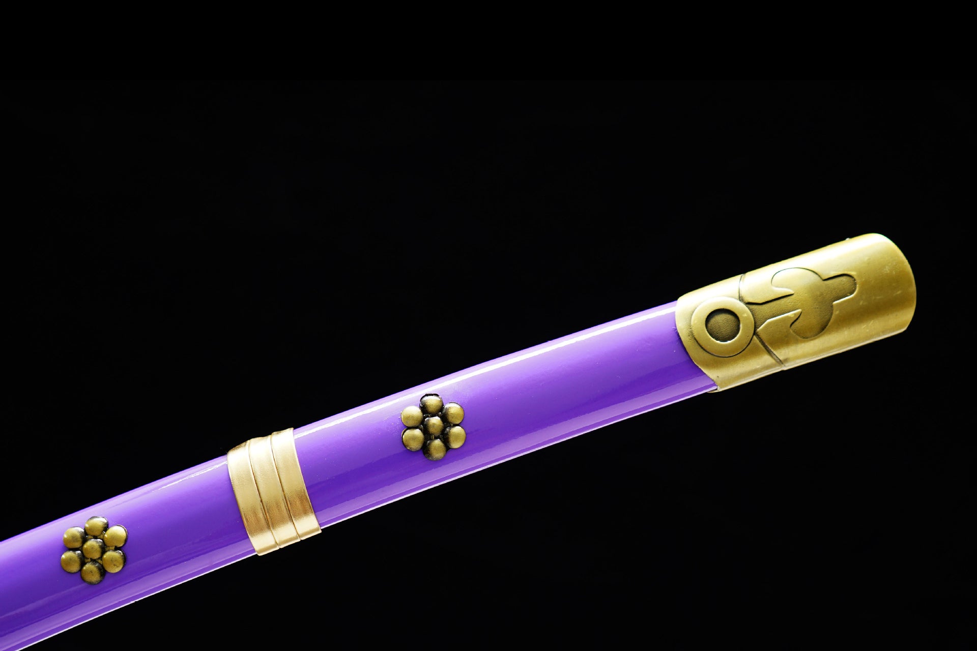 The purple Saya of the Enma sword decorated with gold petals.
