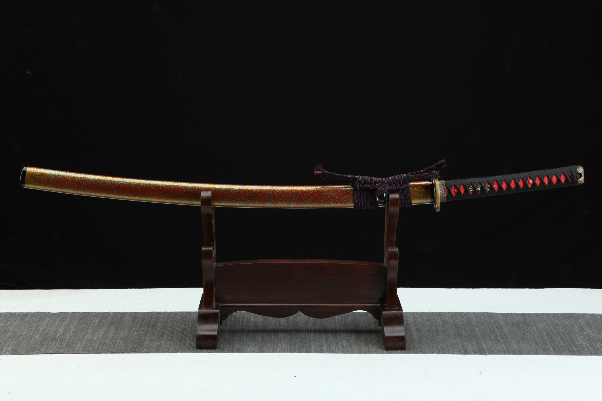 Full view of Shinrin Samurai Sword with colorful lacquered scabbard and handle wrapped with black ito and red rayskin (samegawa).