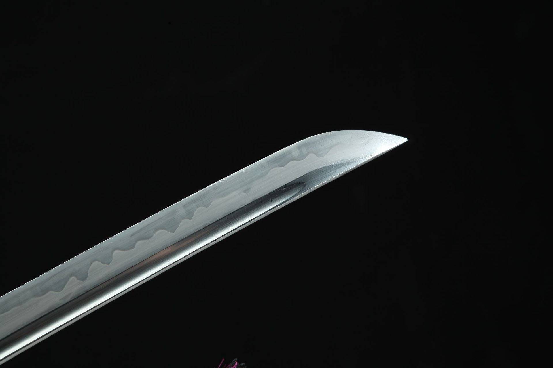 Close-up of Shinrin Samurai Sword blade showcasing the clay-tempered edge and the distinctive pattern of the T10 steel.