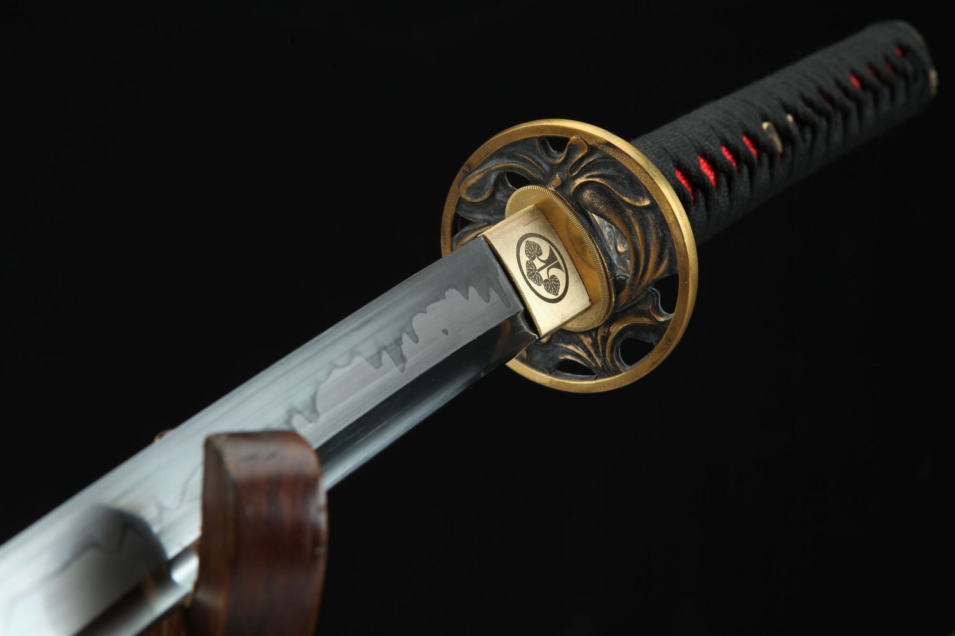 Close-up of Shinrin Samurai Sword showing the T10 steel blade with clay-tempered edge and detailed guard with intricate design.