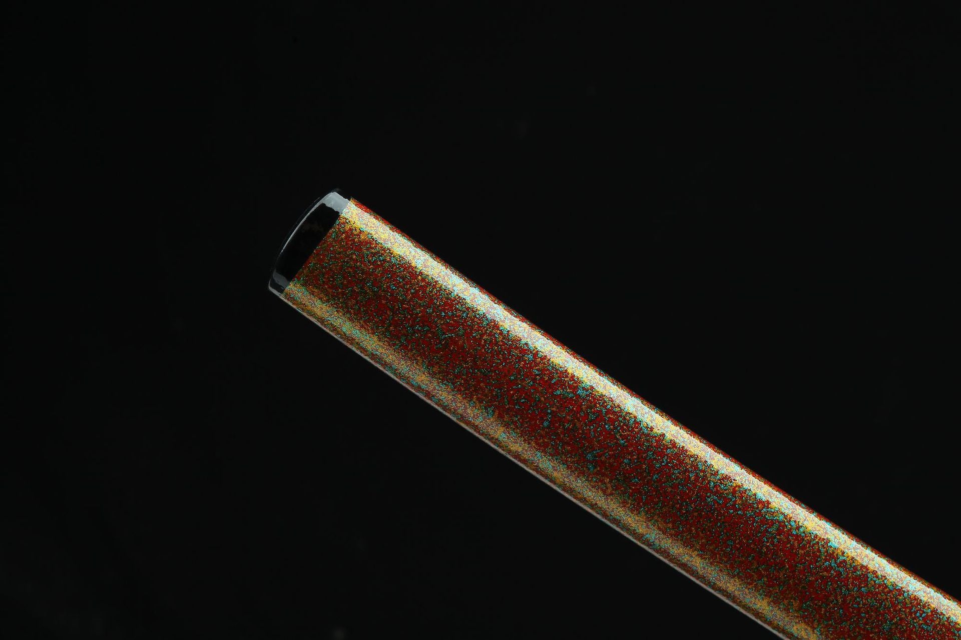 Close-up of Shinrin Samurai Sword scabbard, featuring colorful lacquered surface with intricate texture.
