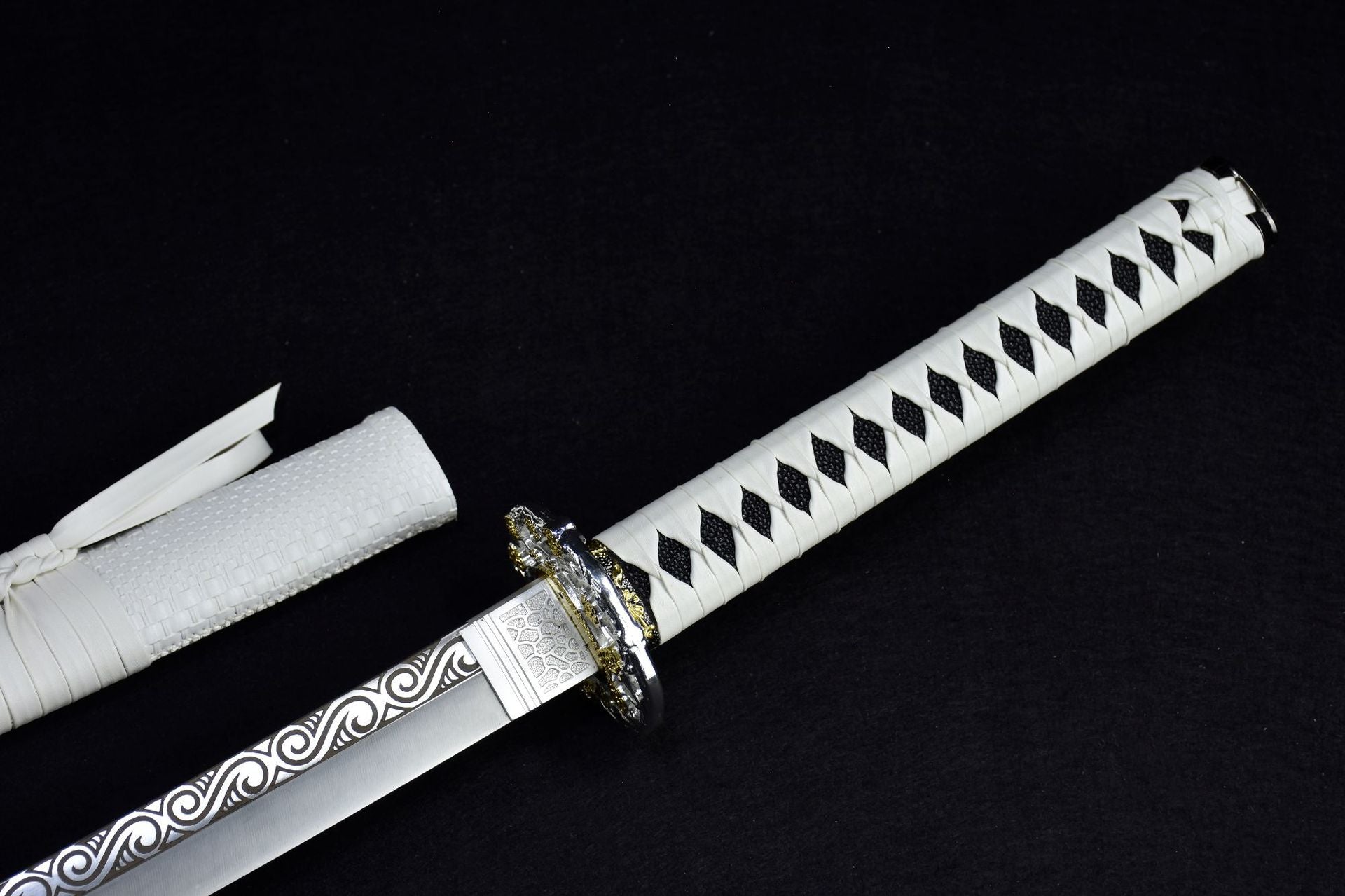 A white samurai sword handle displayed on a black background
