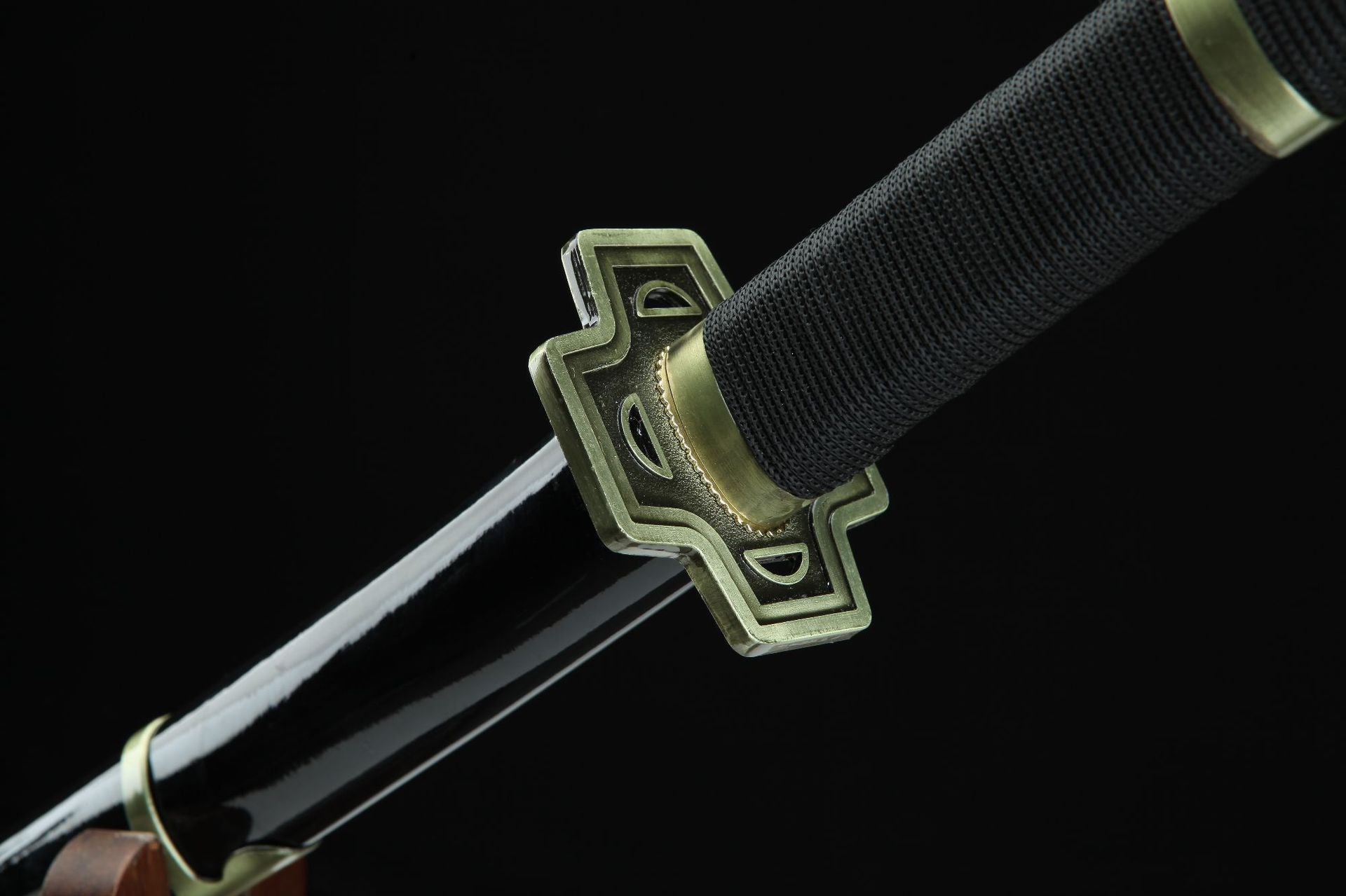 A close-up of the Yubashiri sword handle, guard, and sheath, showcasing their detailed craftsmanship.