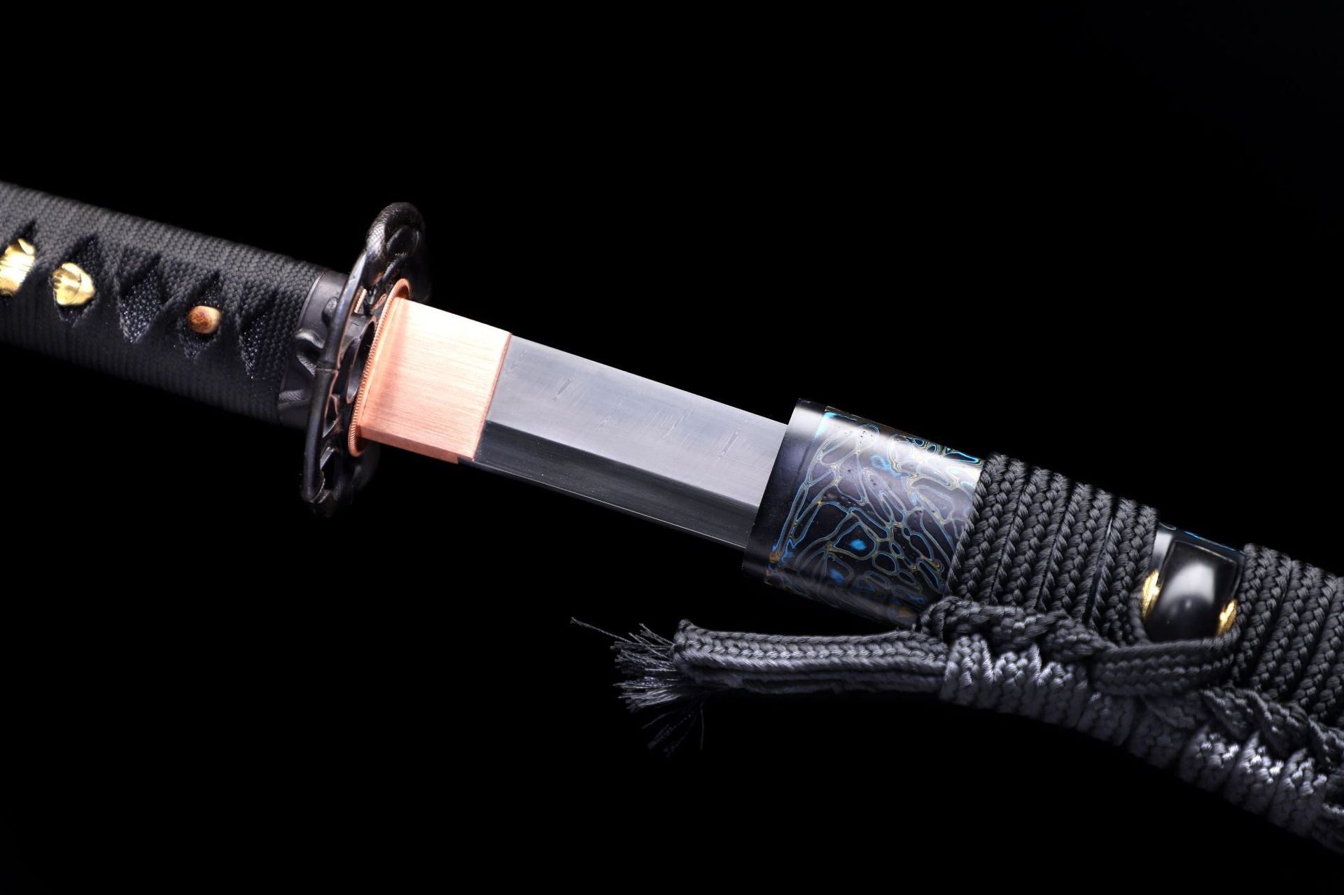 Close-up of the samurai sword's habaki and scabbard mouth (koikuchi), designed to ensure the sword fits securely into the scabbard.
