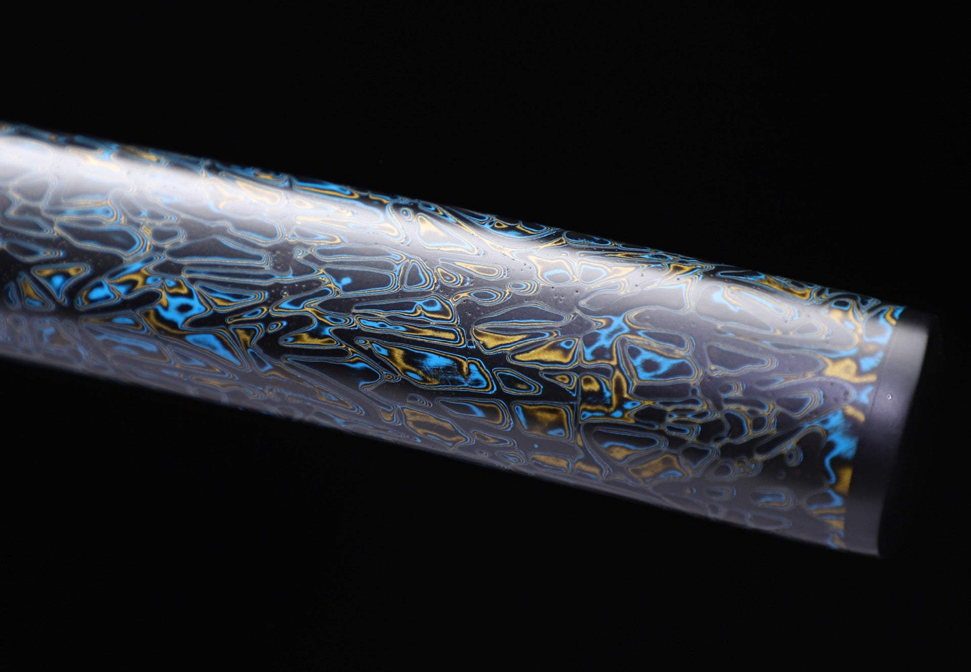 Detailed view of a samurai sword scabbard (saya) showcasing an iridescent lacquer finish that creates a mesmerizing effect.