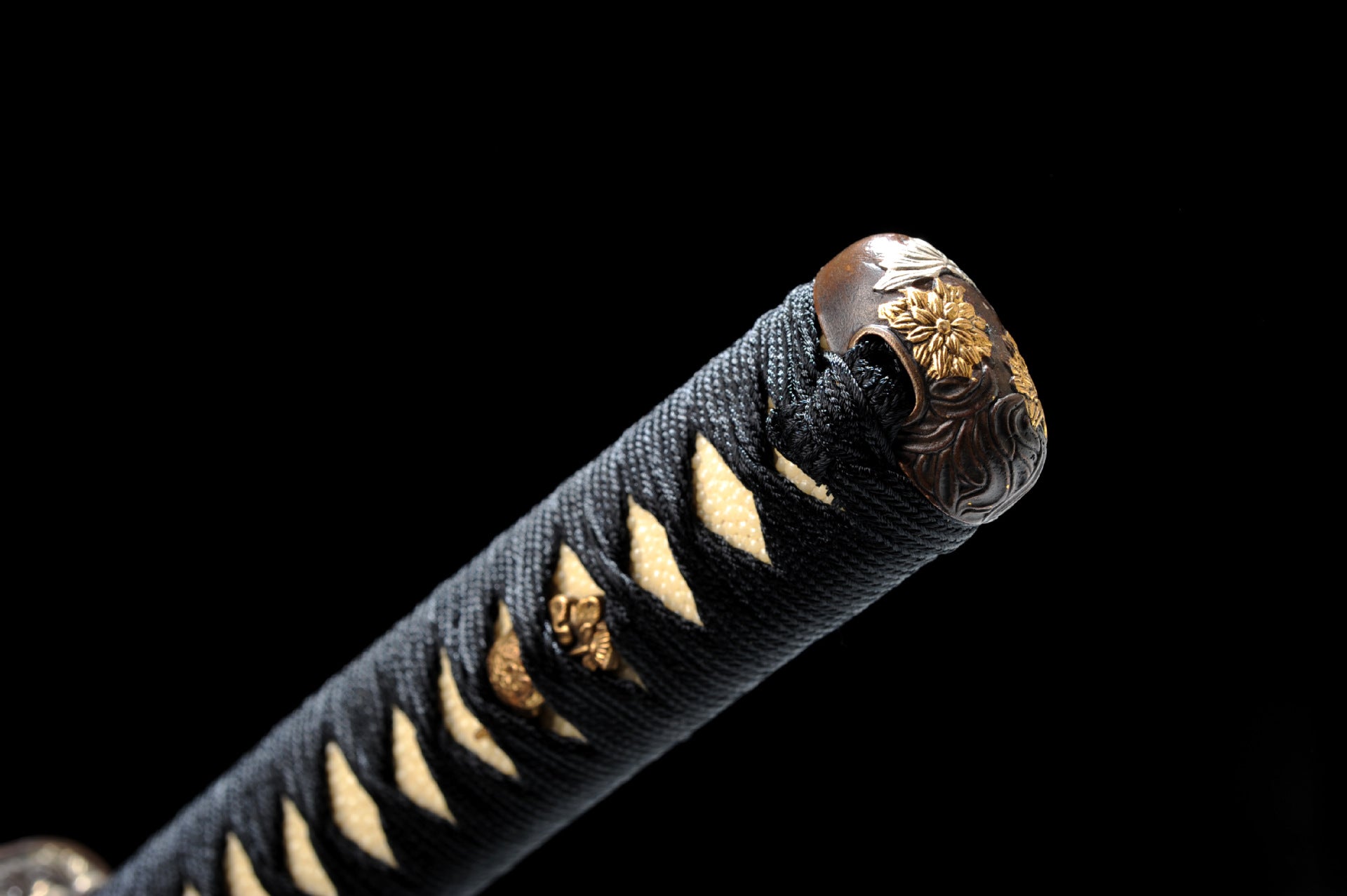 Traditional carved katana pommel.