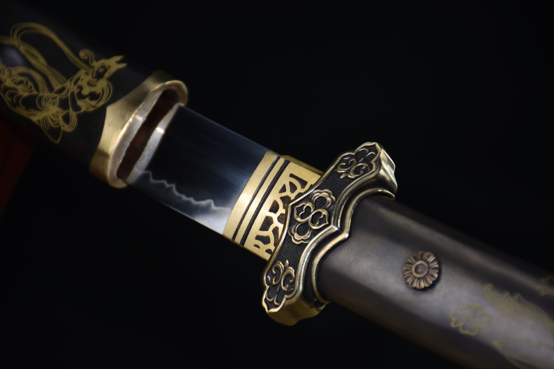 Close up of the Celestial samurai sword blade and guard featuring intricate gold accents