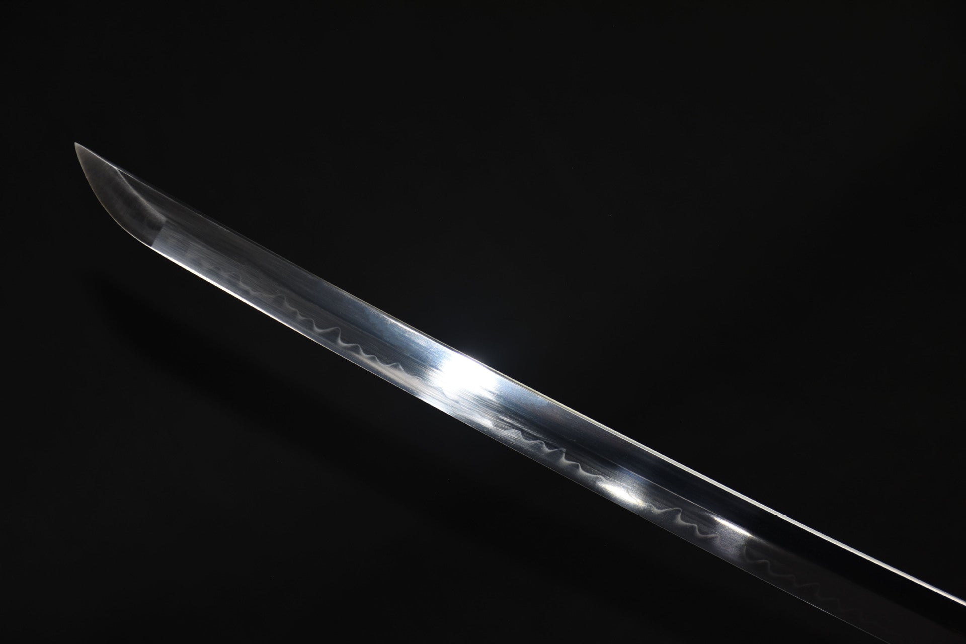 Close up of the Celestial samurai sword blade tip with a polished finish and hamon line