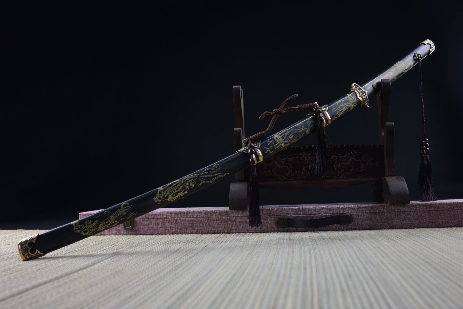 Full view of the Celestial samurai sword resting with gold goddess engravings