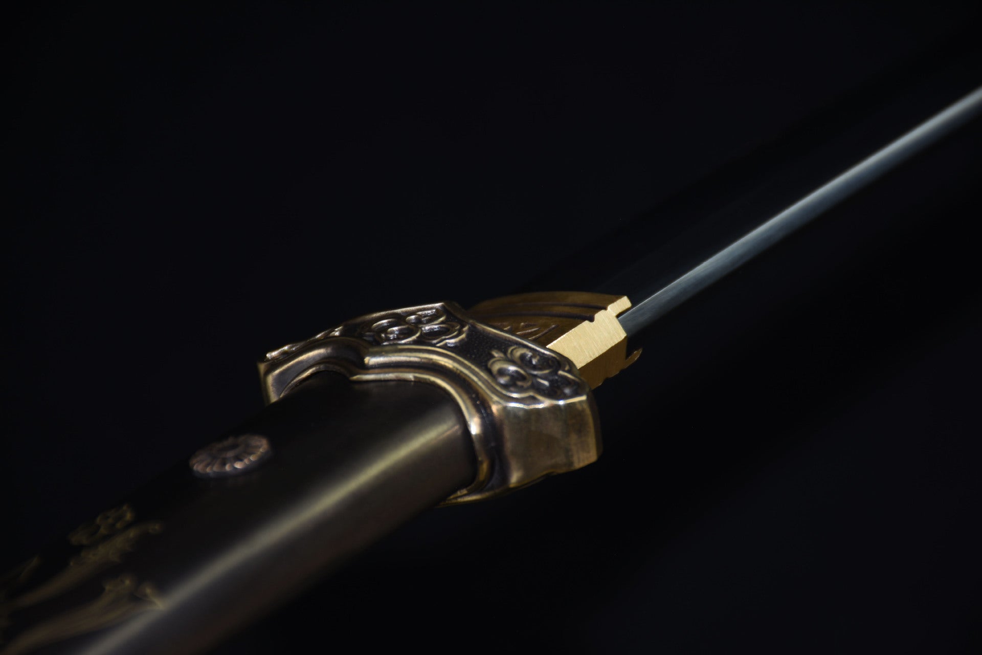 Close up of the Celestial samurai sword guard featuring ornate gold detailing