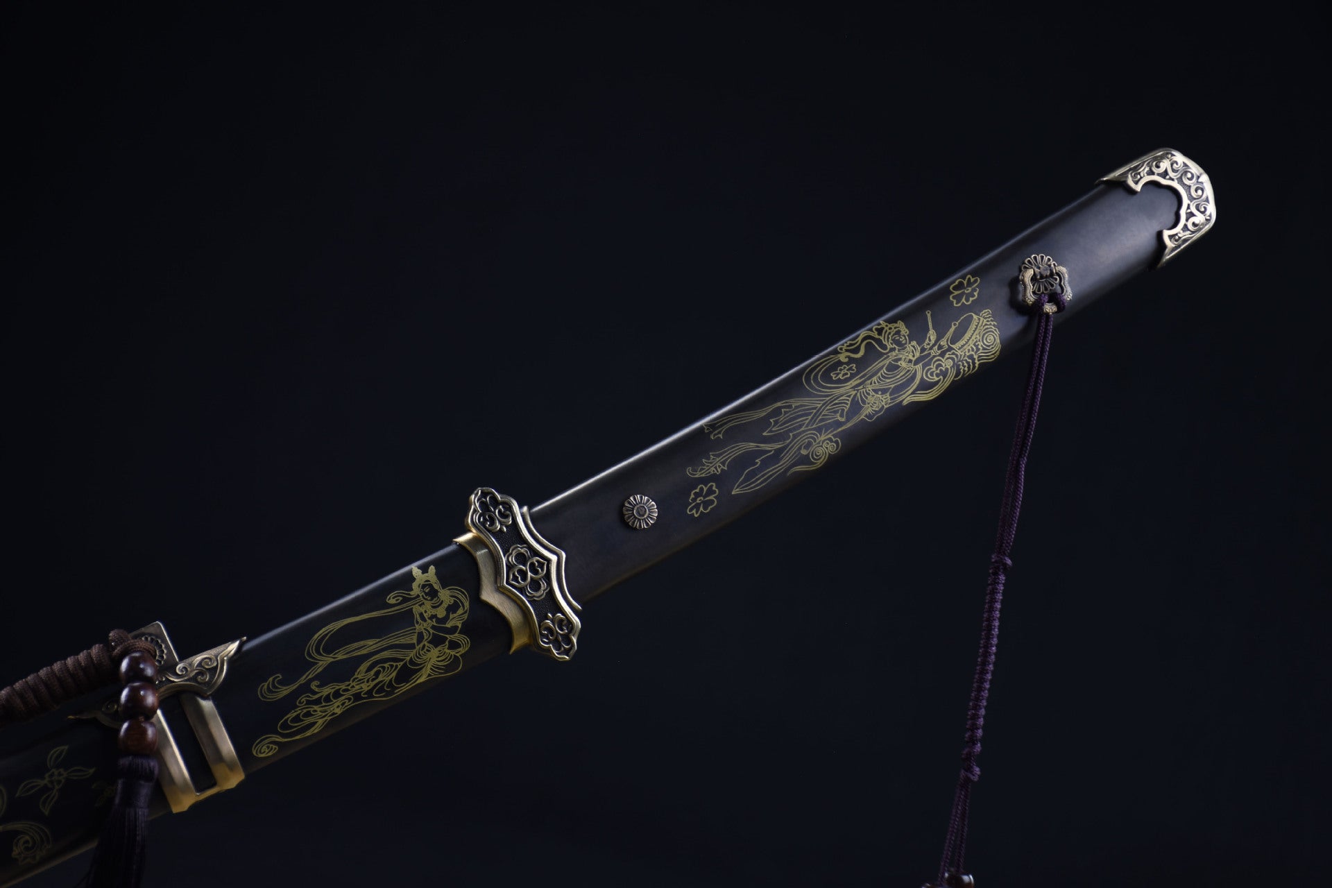 Celestial samurai sword tsuka with detailed gold engravings and ornate fittings