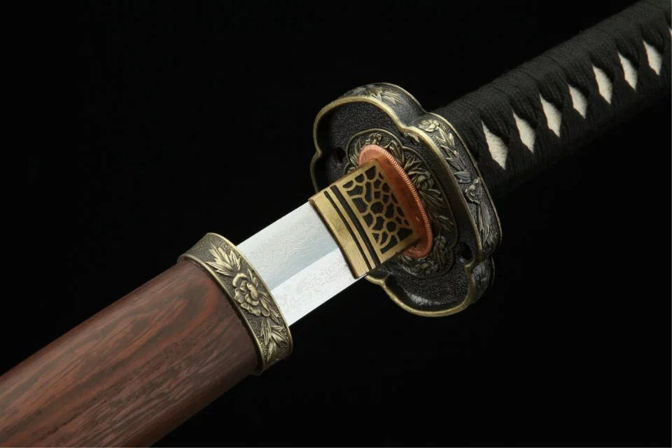 Chrysanthemum alloy tsuba on a katana, showcasing traditional Japanese craftsmanship and elegant design.