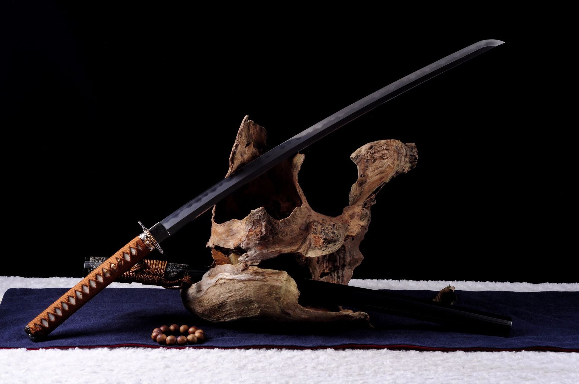 Brown clay-tempered Daisy katana with a black saya.