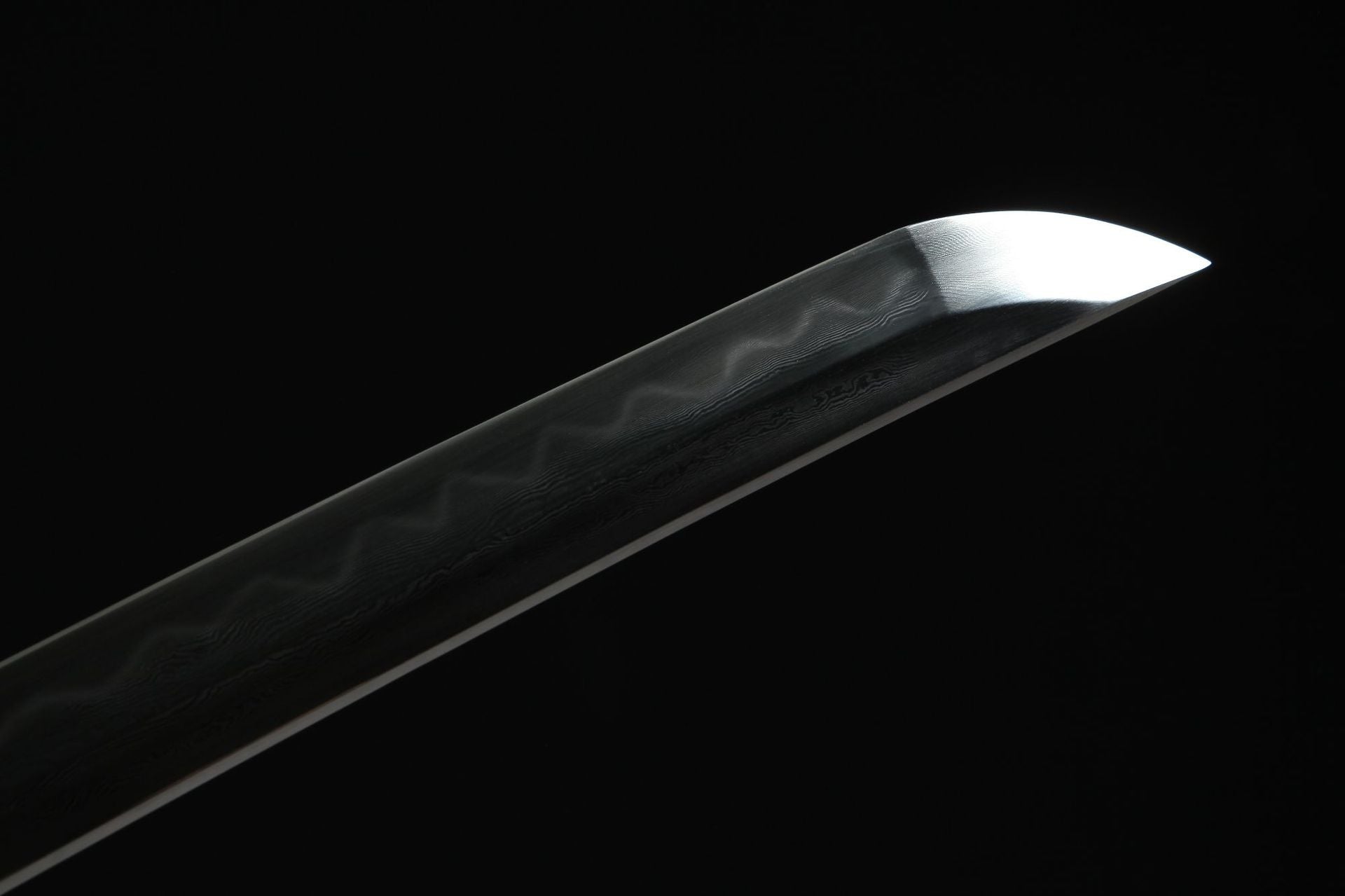 Damascus steel blade with hamon on Nine Lions sword.