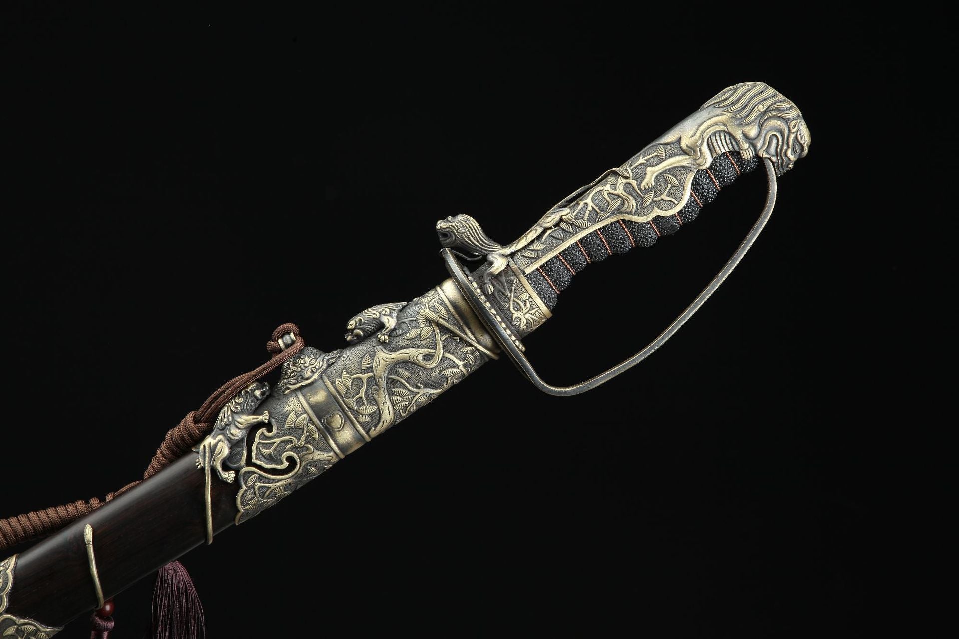 Decorative tsuka and saya fittings on Nine Lions gunto.