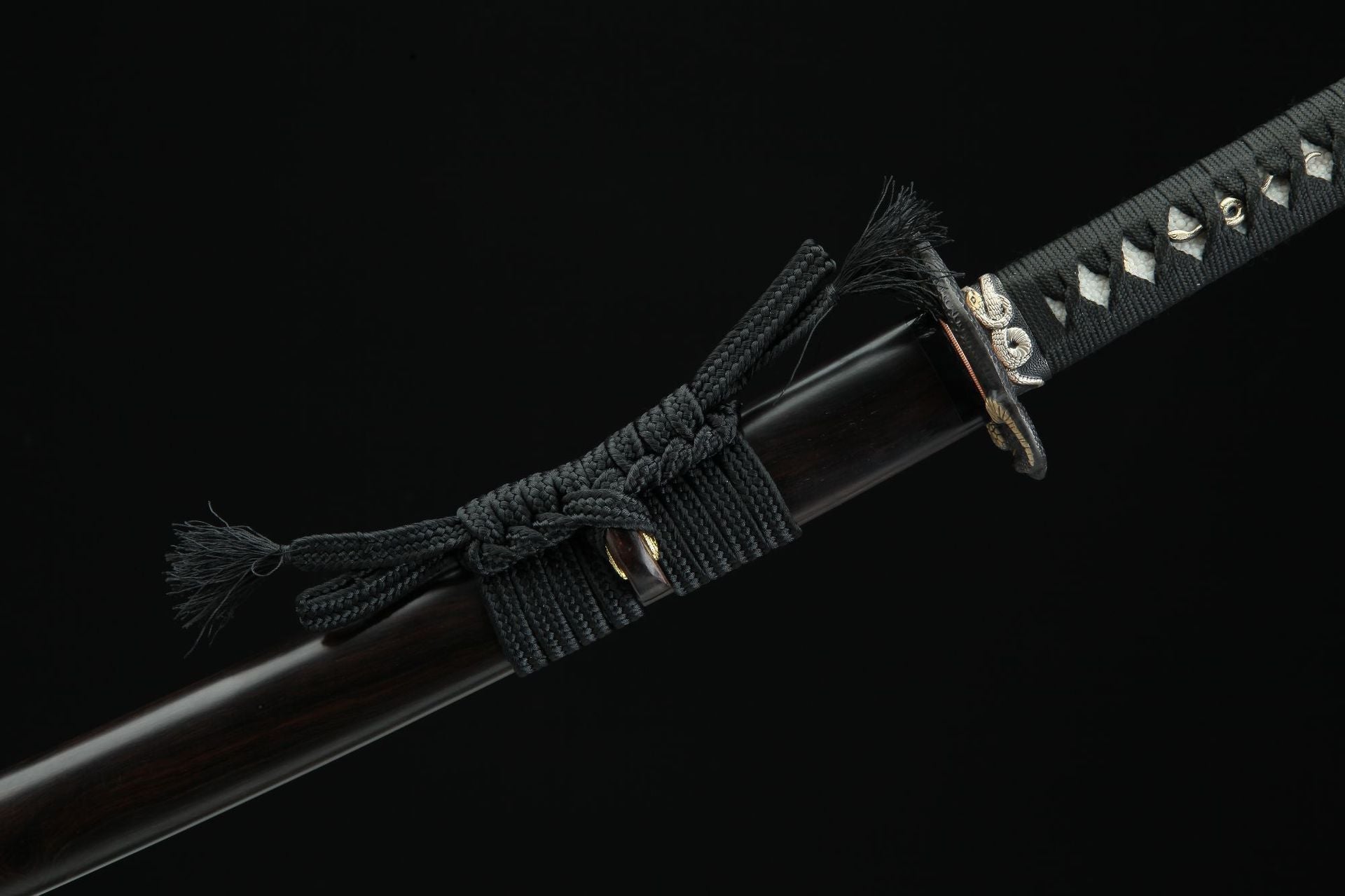 Detailed view of the sageo on Hebi katana, showing the knotted cord on the scabbard and handle.