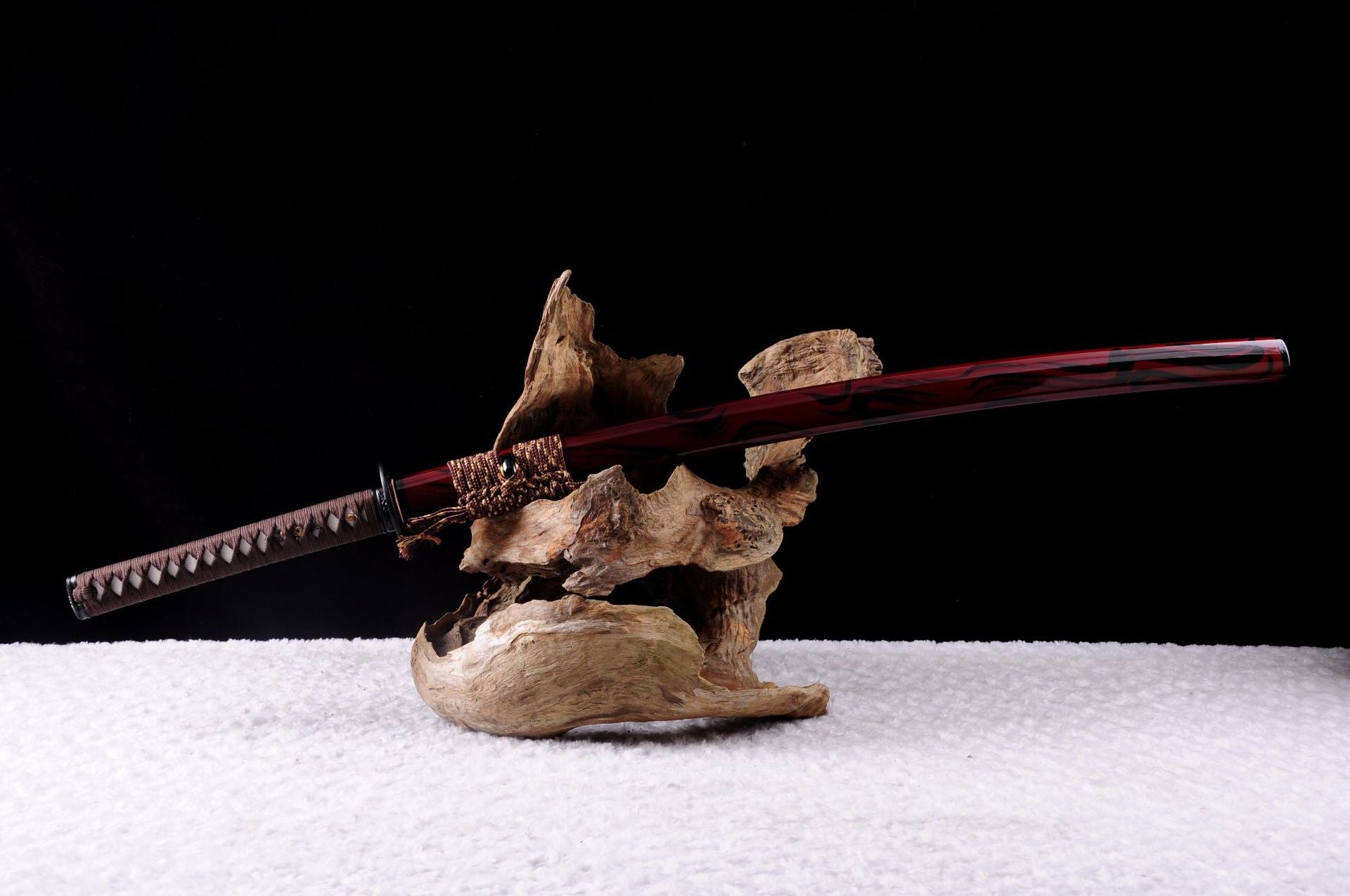Complete view of the Kashin katana featuring its sword mountings on a natural wooden backdrop.