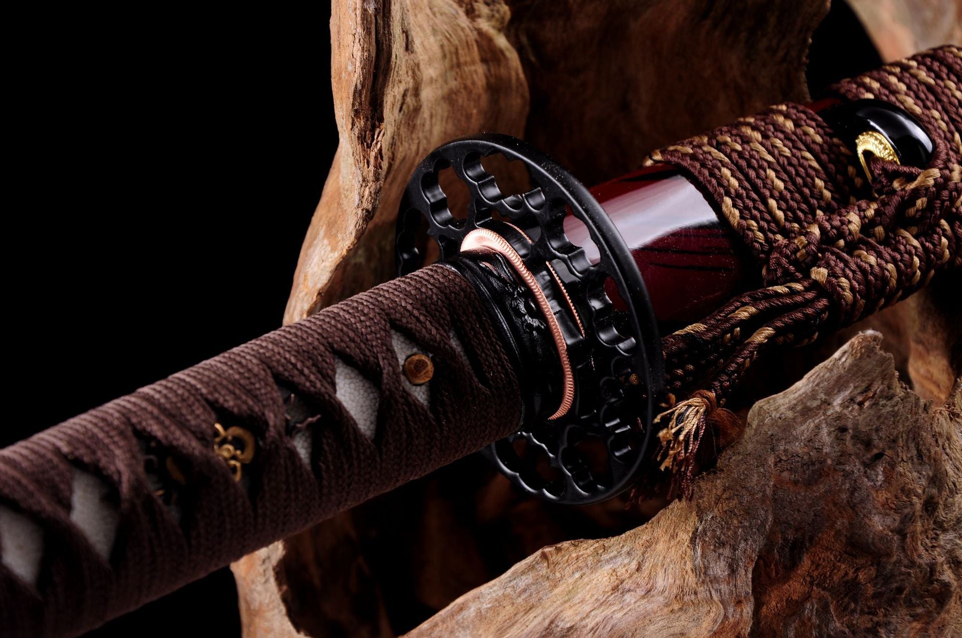 A Kashin katana with a round sukashi tsuba featuring detailed craftsmanship on the hilt.