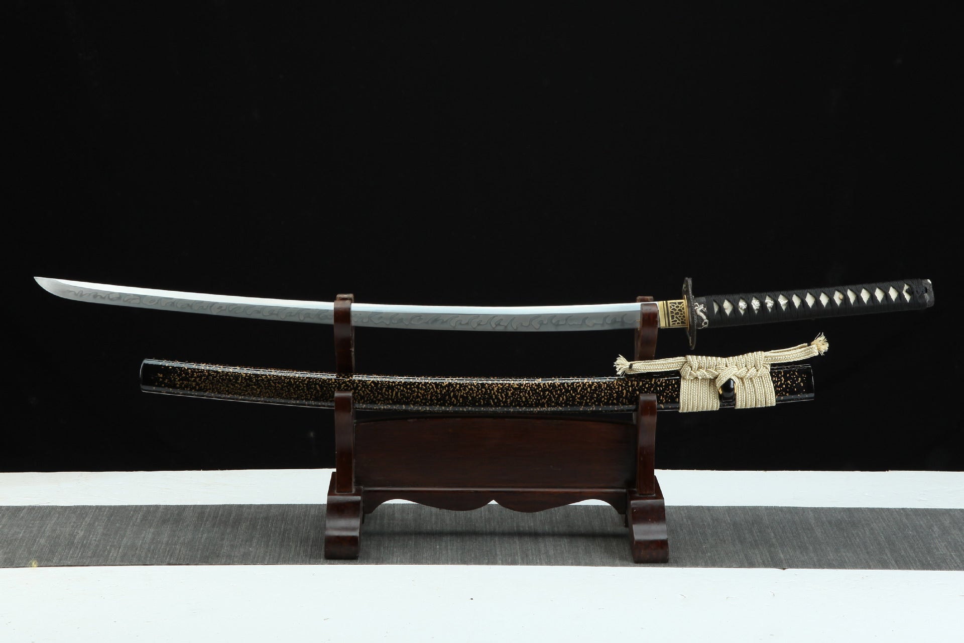 Panoramic view of the Loong Clow katana, showcasing the entire sword with its detailed blade, handle, and scabbard.