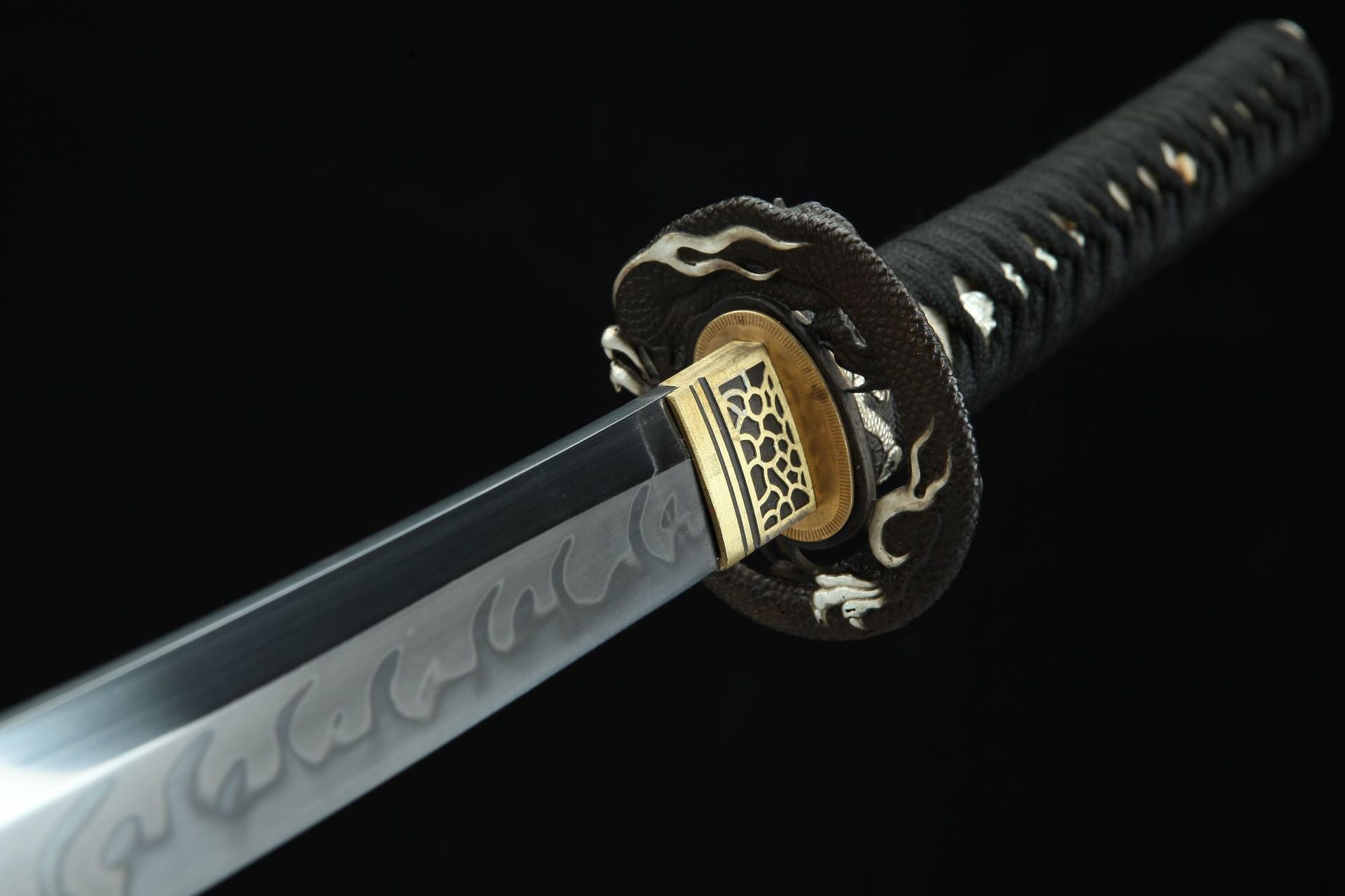 Detailed view of the other side of the Loong Clow katana's tsuba, featuring intricate metal craftsmanship.