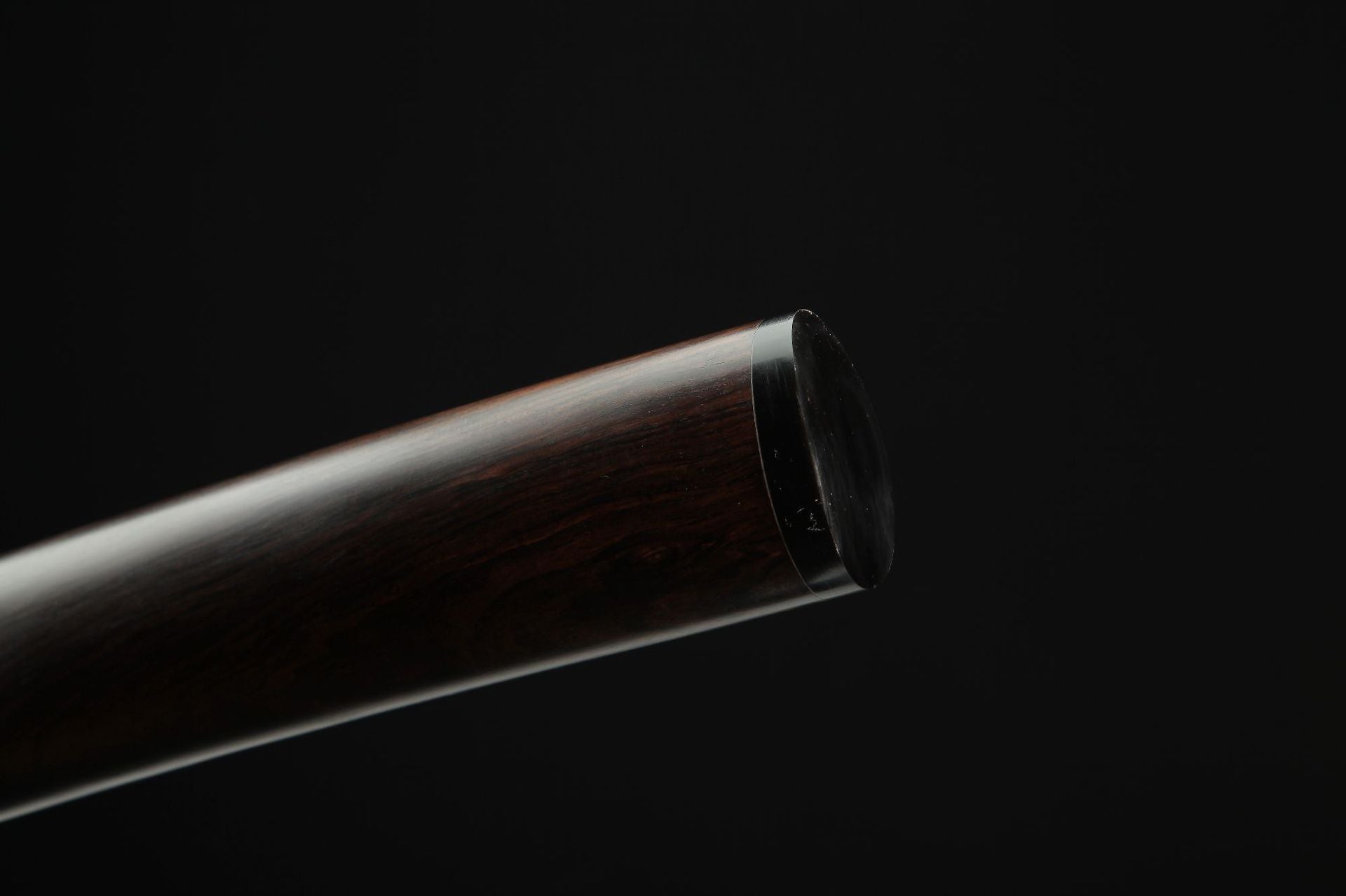 Close-up view of the Lotus katana's kojiri.