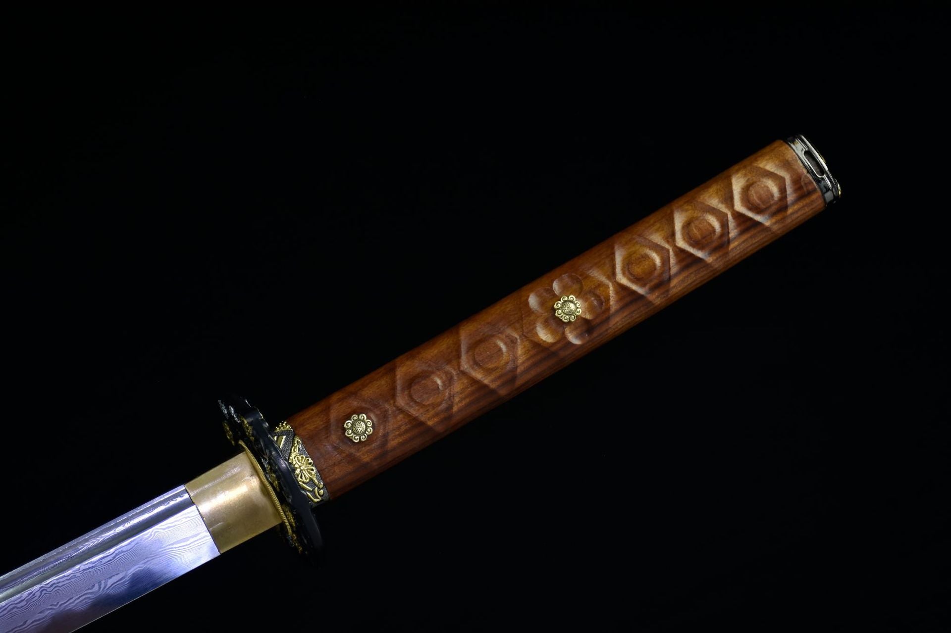 Tsuka of Moonlit Sakura samurai sword, showcasing wood patterns and floral embellishments.