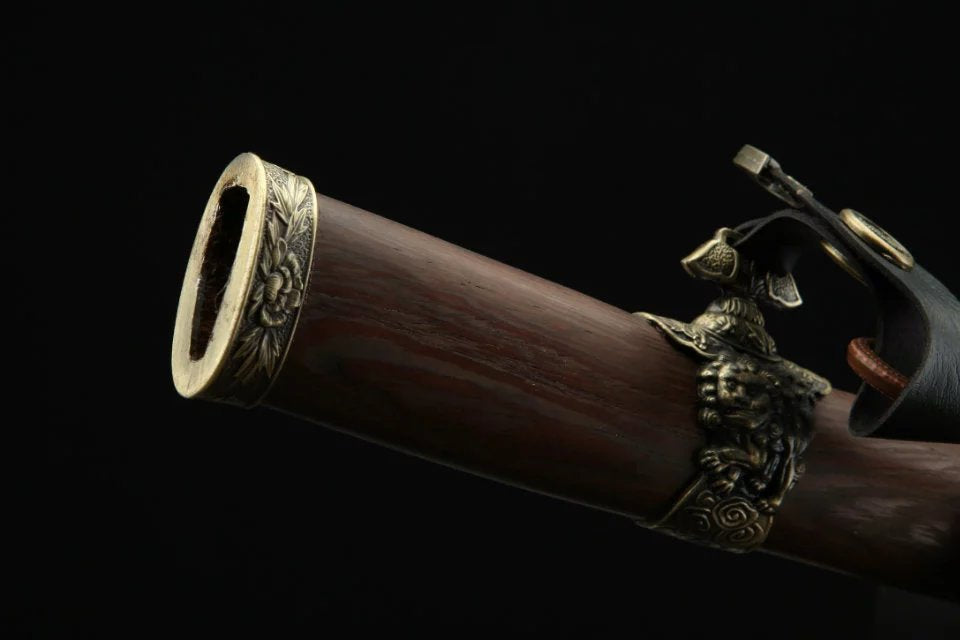 A katana scabbard crafted from natural wood, featuring a finely detailed koiguchi, highlighting elegance and traditional craftsmanship.