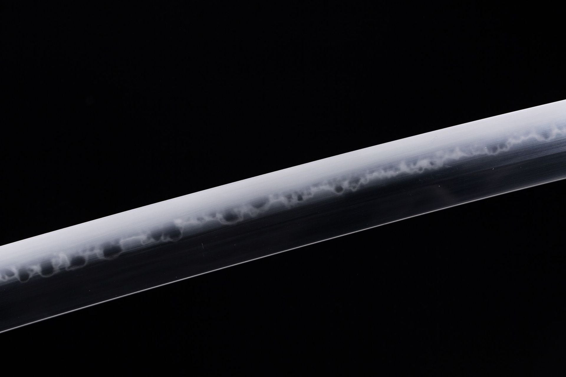 Detail of Orochi katana blade, displaying the unique hamon characteristic of fine craftsmanship.