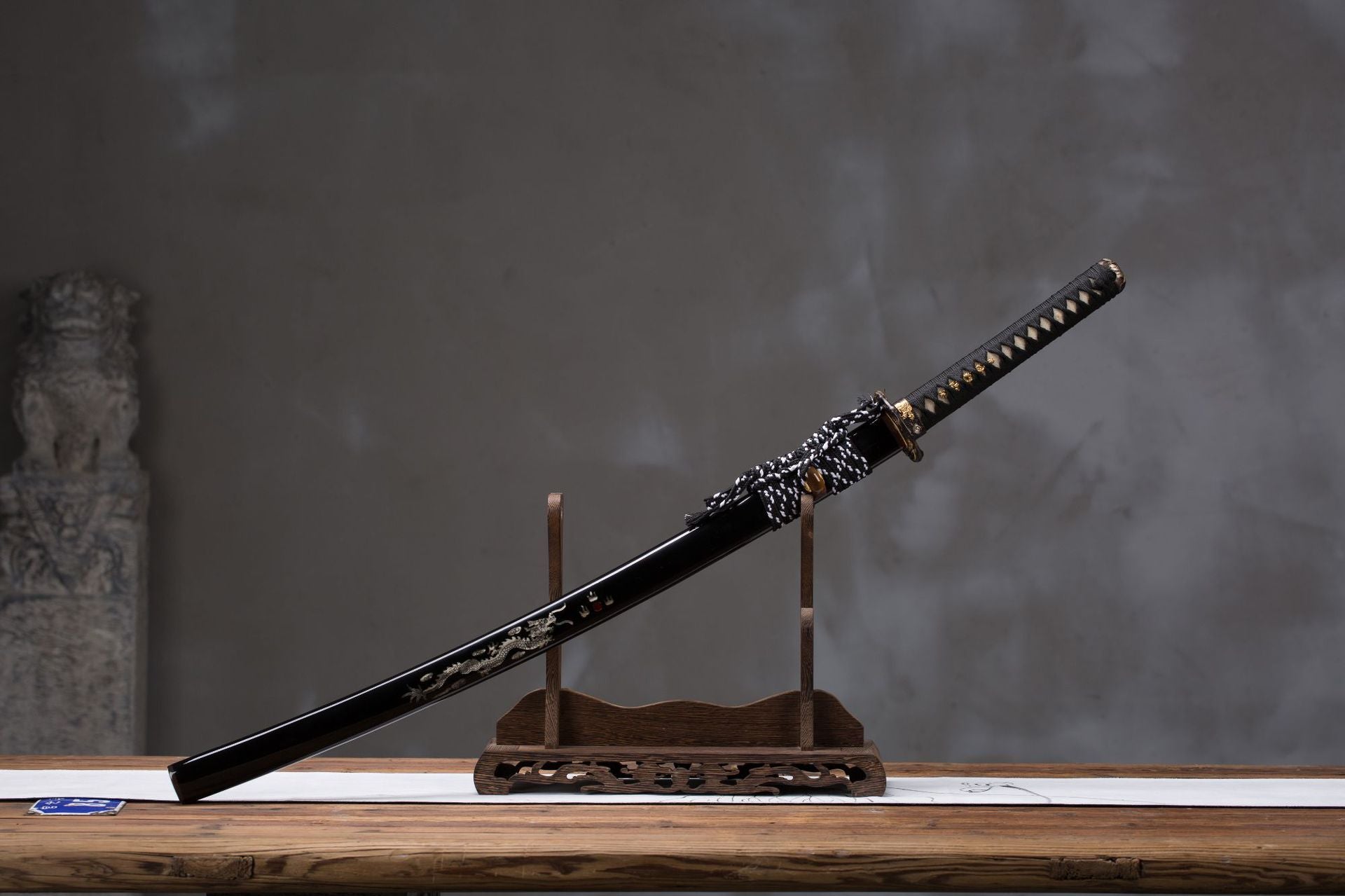Full display of the Orochi katana's koshirae, showcasing the sword's complete assembly with detailed decorations.