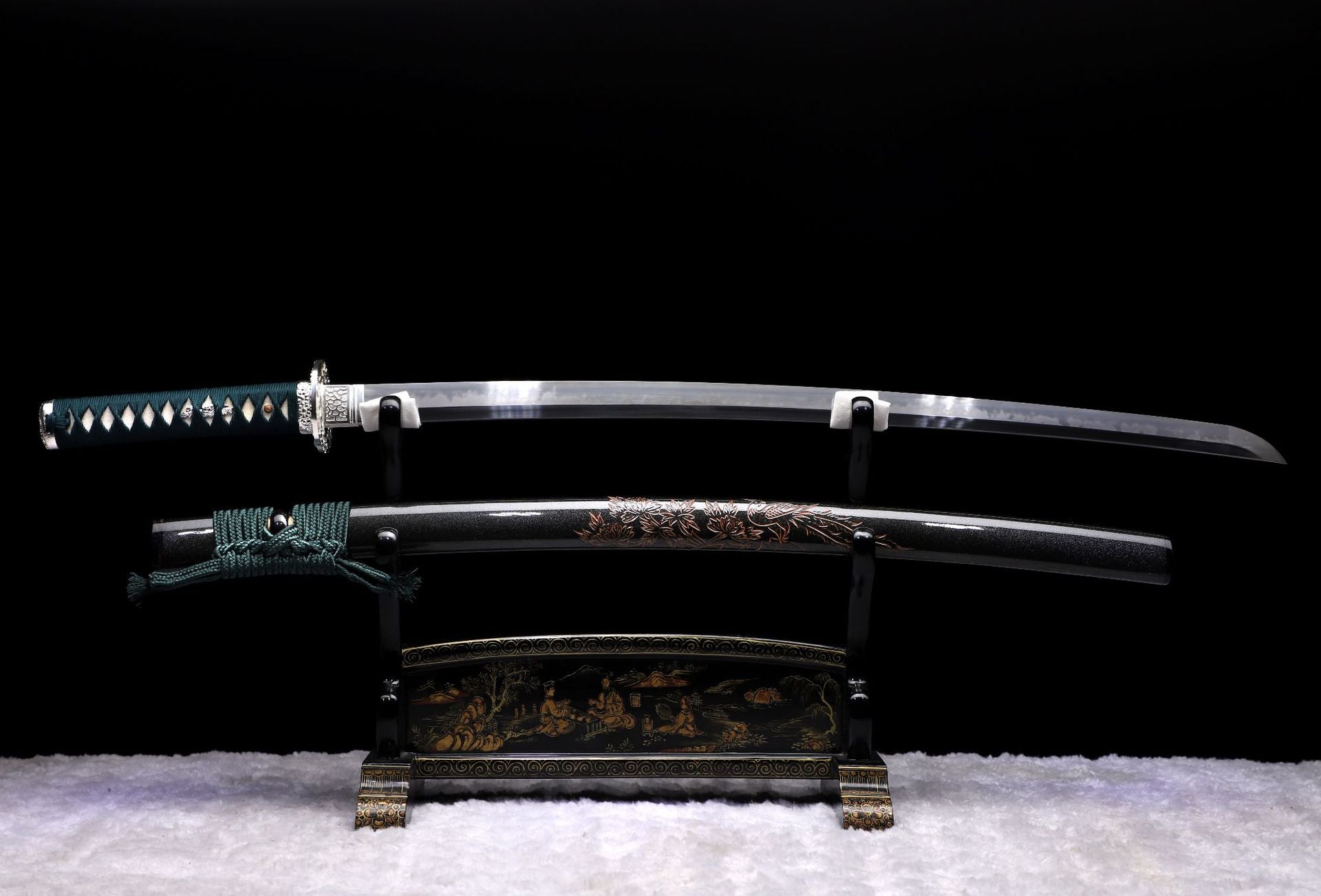 Phoenix samurai sword displaying a clay-tempered smooth blade and a beautifully decorated sword mountings.