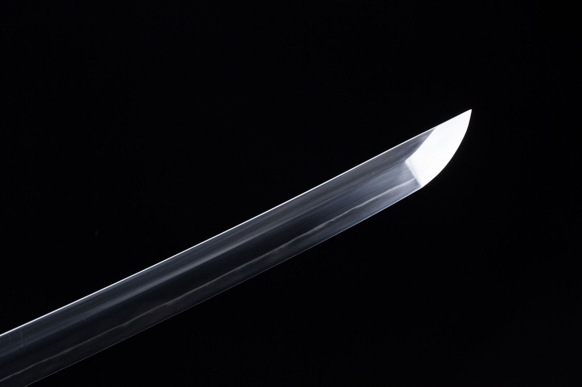 A premium T10 katana blade displayed against a black background, highlighting its sharp edge, polish, and exceptional craftsmanship.