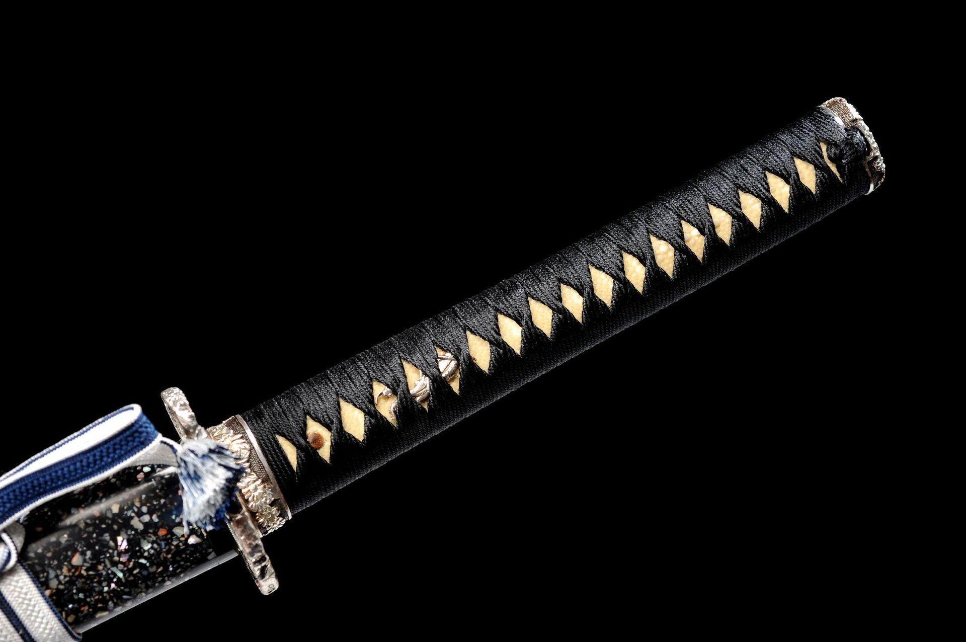 Black handle paired with genuine ray skin.