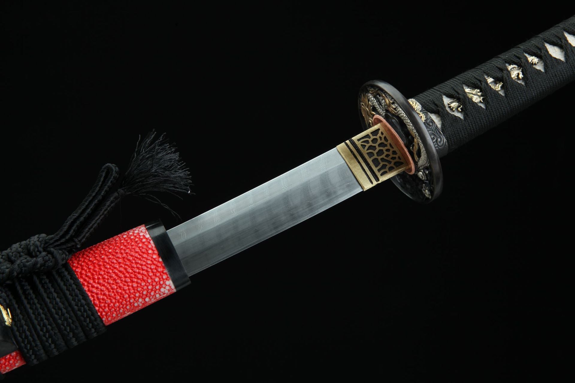 Detailed view of sakura ryu katana showing the habaki and the koikuchi, essential for securing the blade into the scabbard.