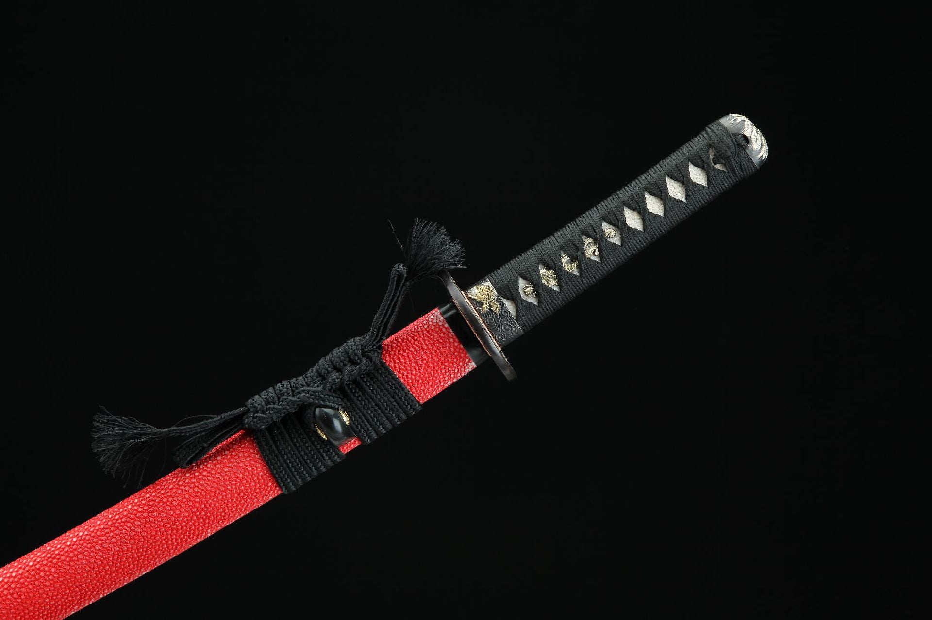 Close-up of handle (tsuka) featuring real white ray skin under a traditional black cord wrap (tsukamaki).